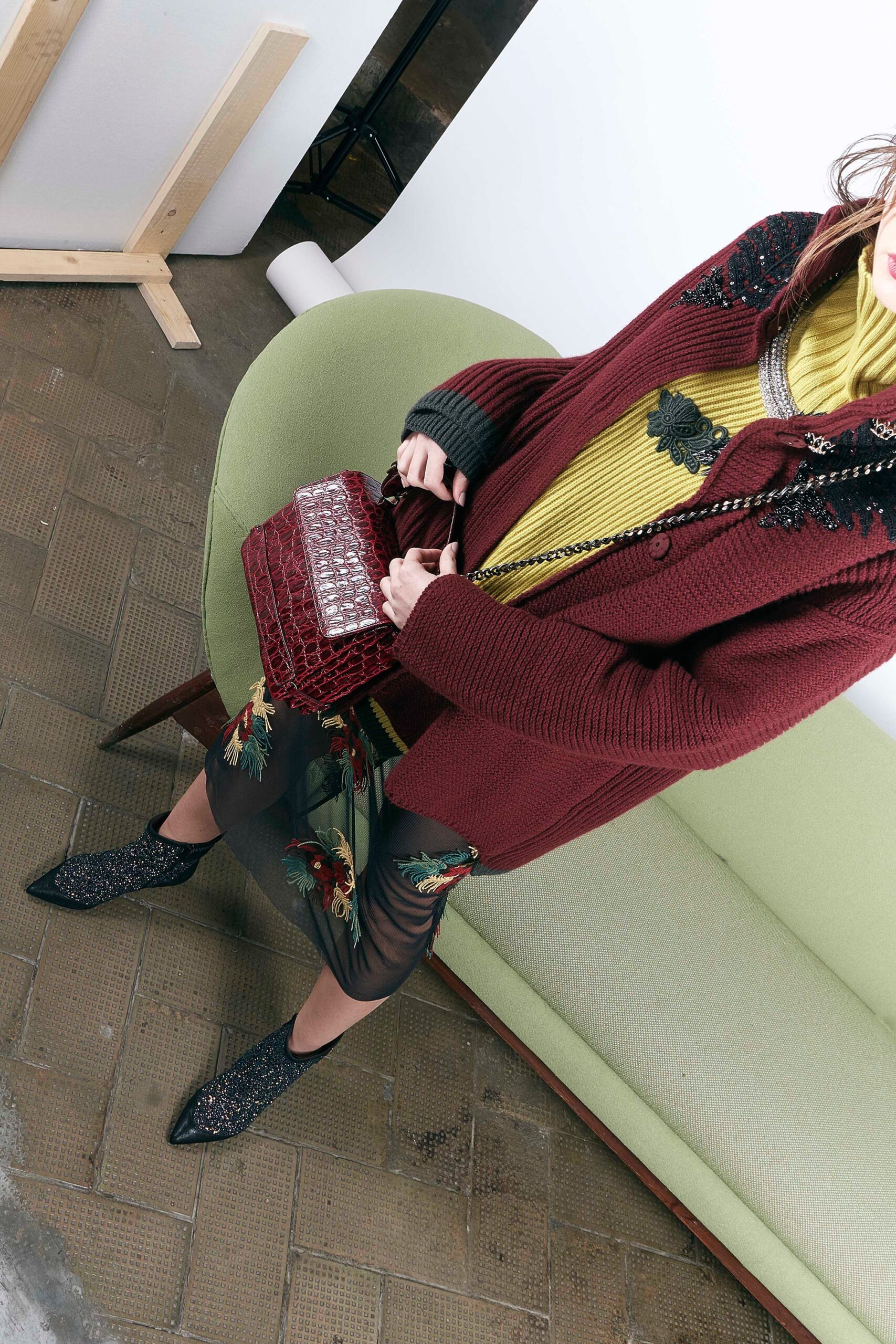 red cardigan yellow top black skirt