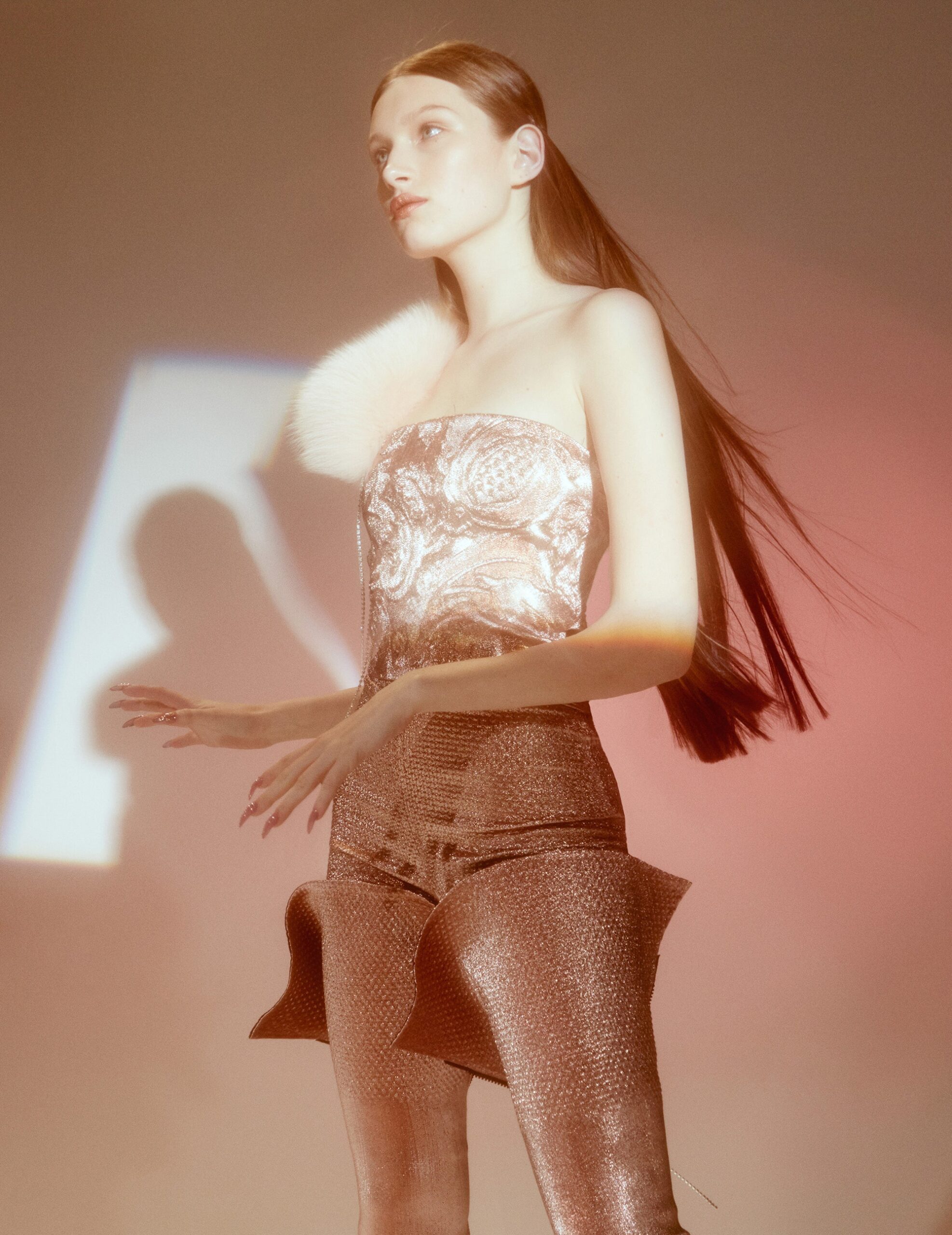 silver embellished strapless top and brown flared pants