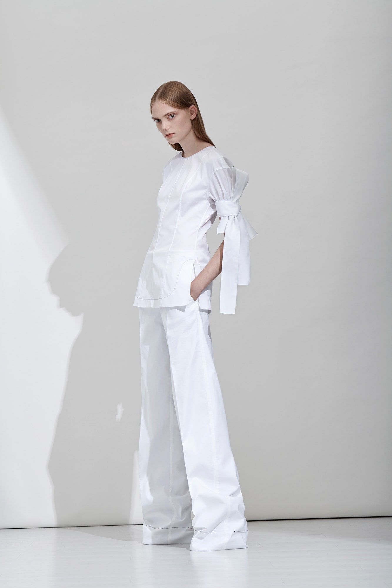 white fitted top with wide-leg pants