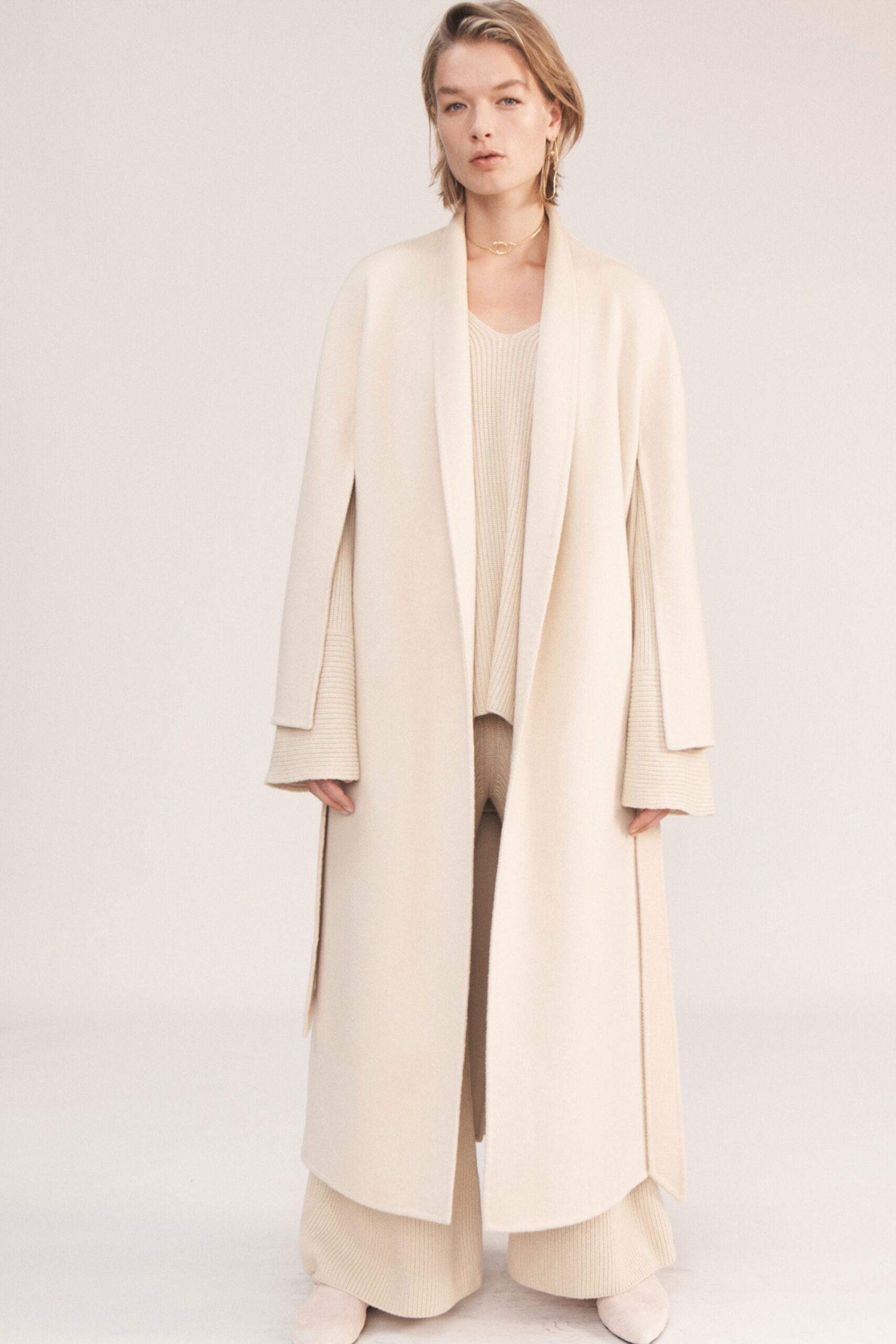beige wool coat with knit top and pants
