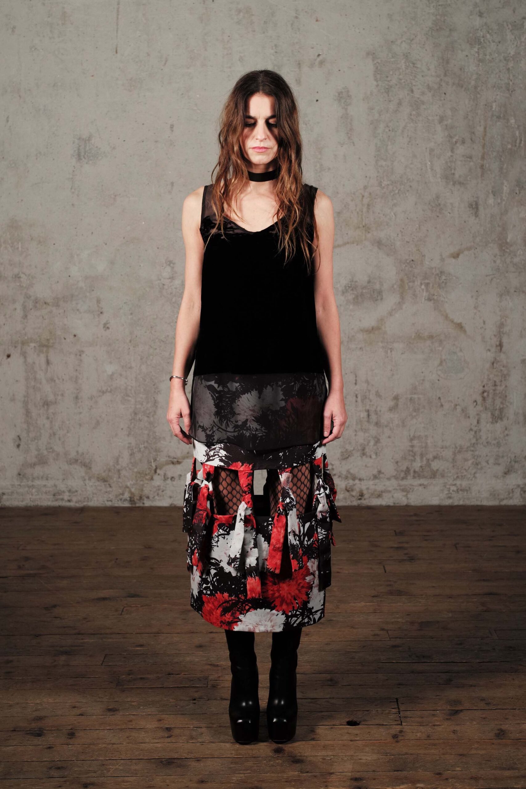 black sleeveless top with pleated skirt