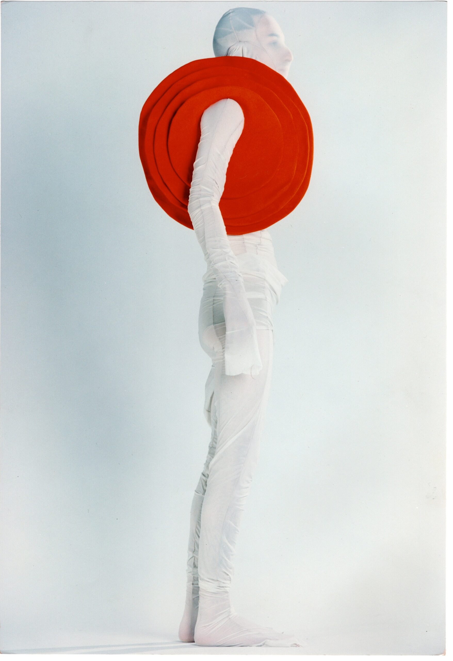 white fitted bodysuit with red cape