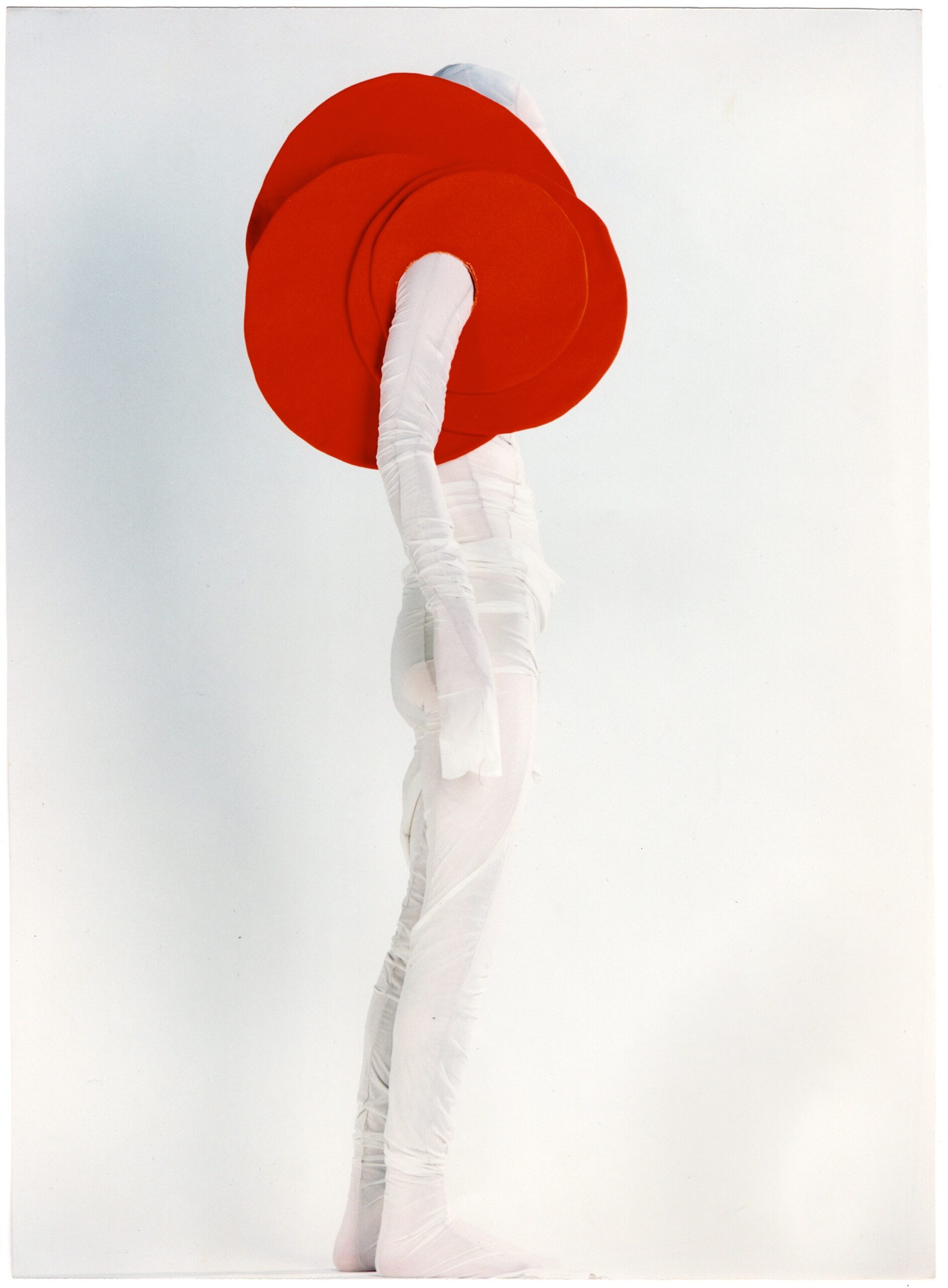 white fitted dress with red hat