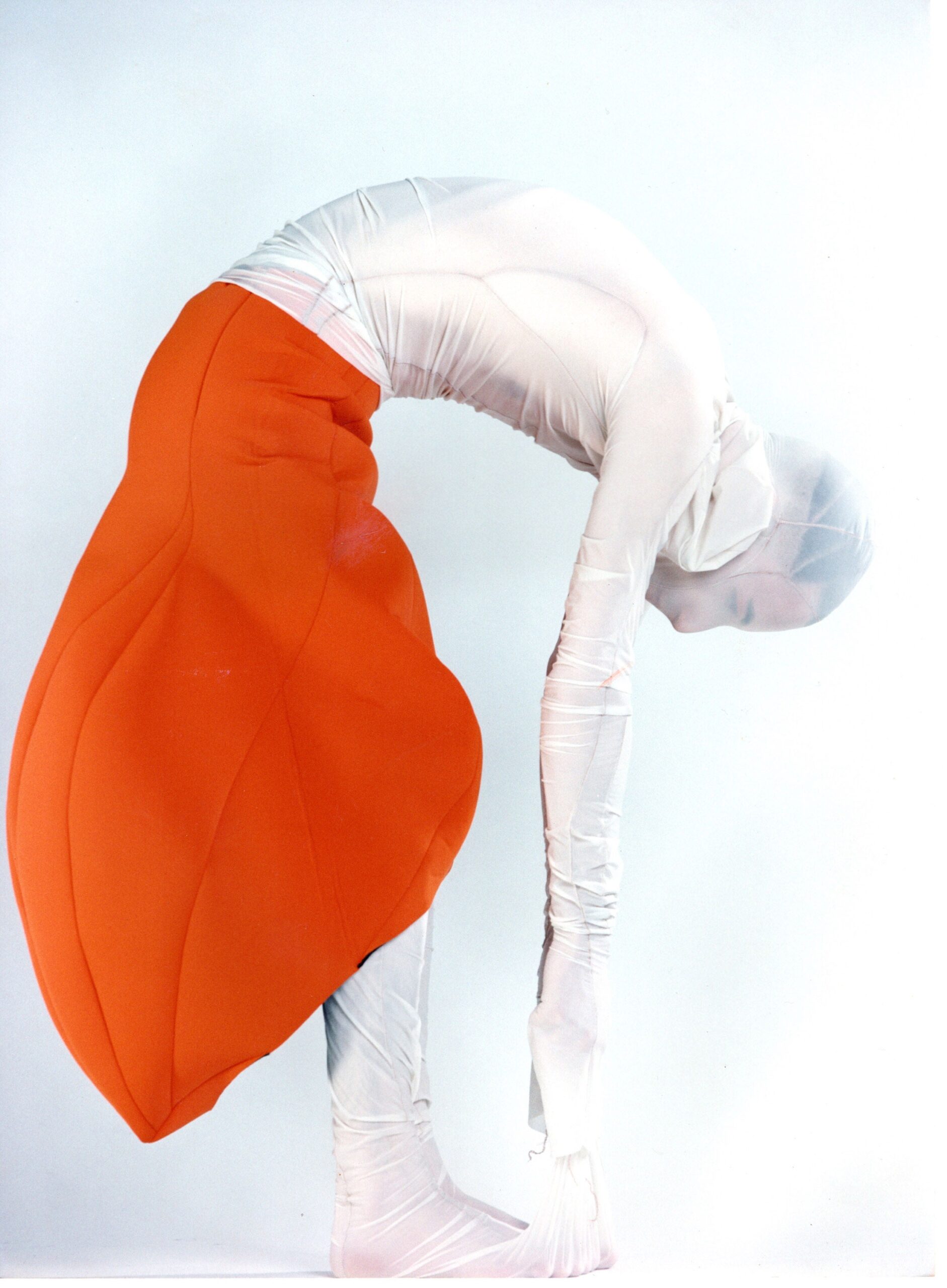 fitted orange midi dress with white top