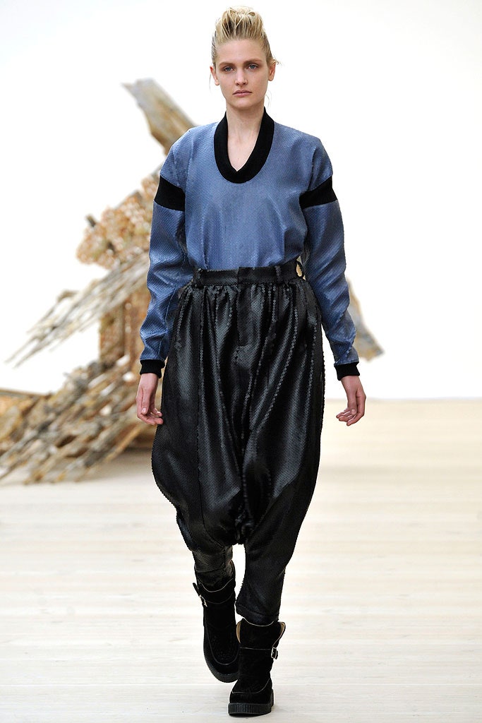 blue silk relaxed top with black pants