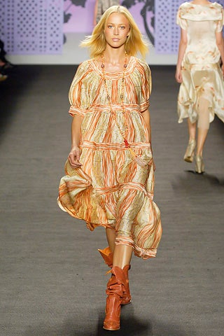 relaxed orange printed midi dress with brown boots