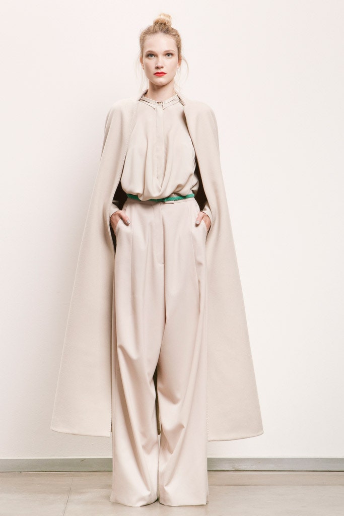 beige wool cape with wide-leg pants