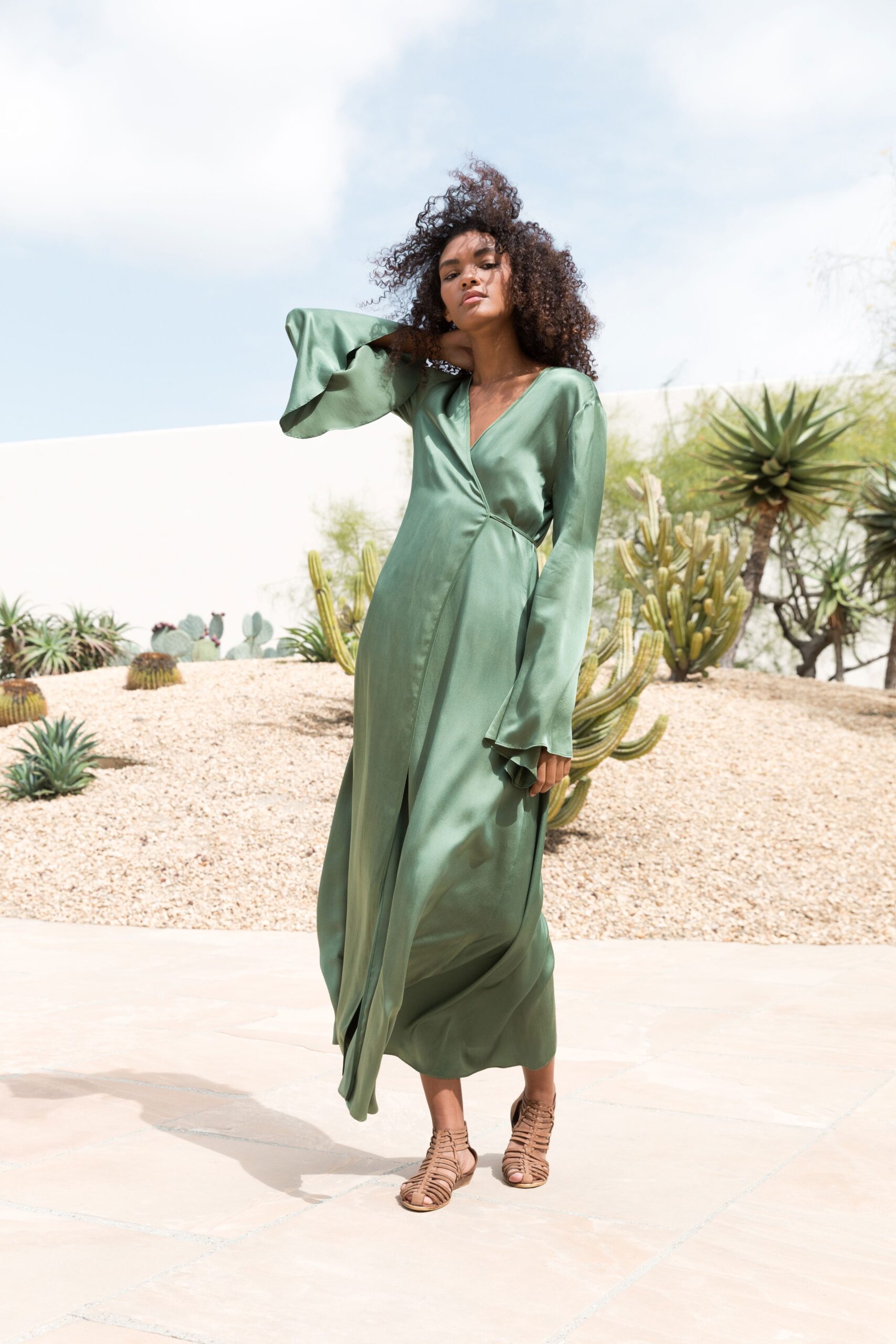 green silk long-sleeve v-neck fitted flowing midi dress