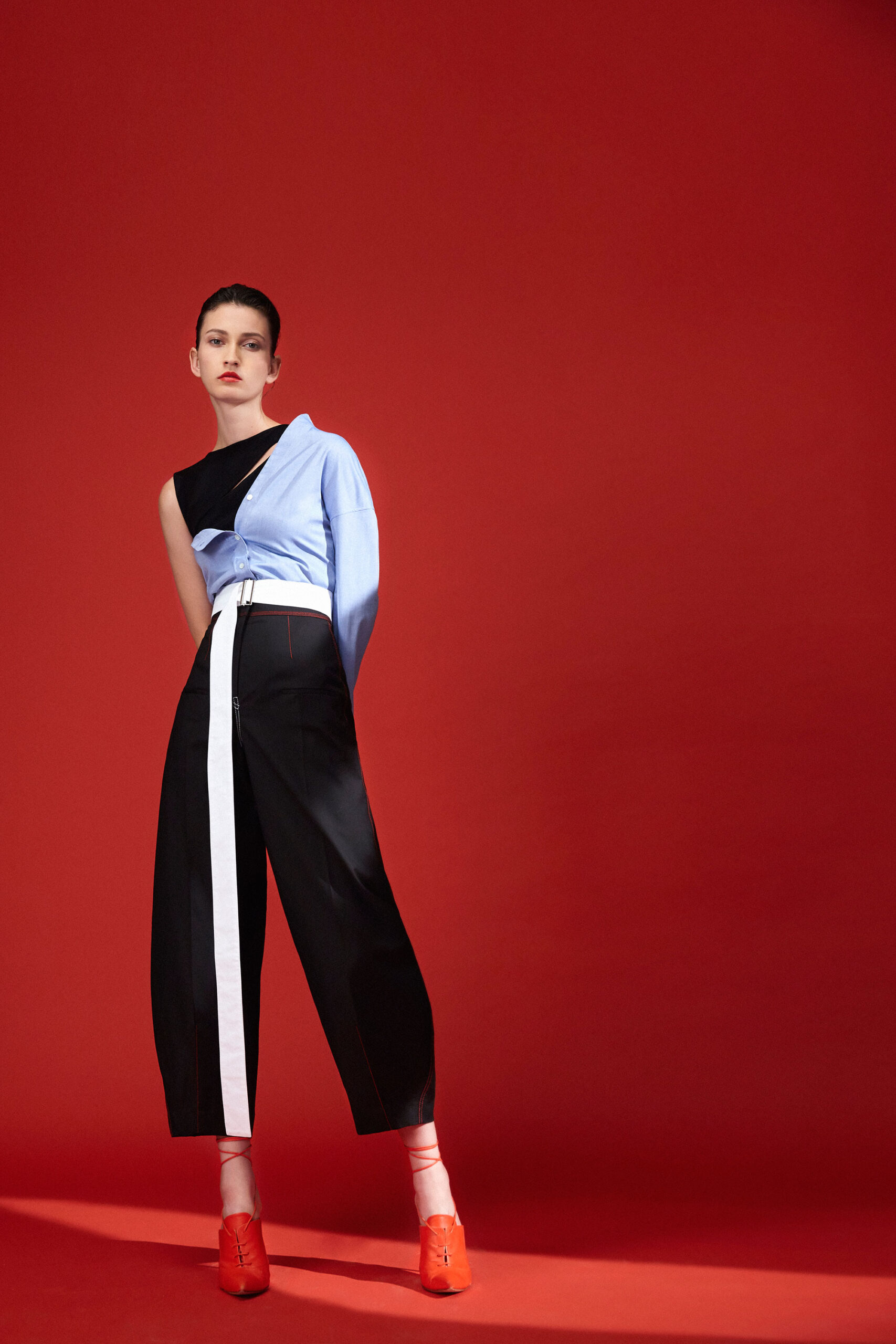 black and blue asymmetric top with wide-leg pants