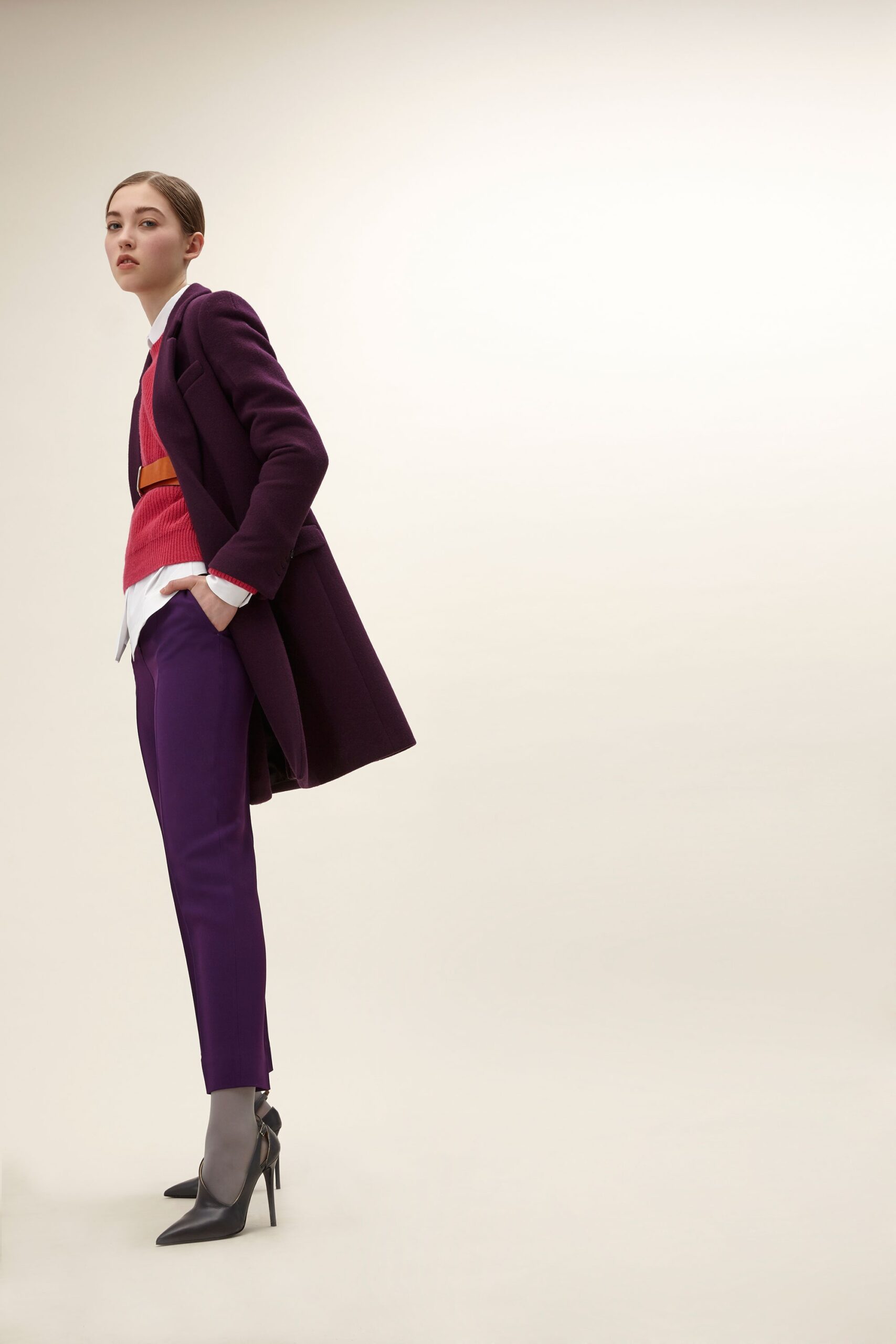 purple tailored coat with red sweater