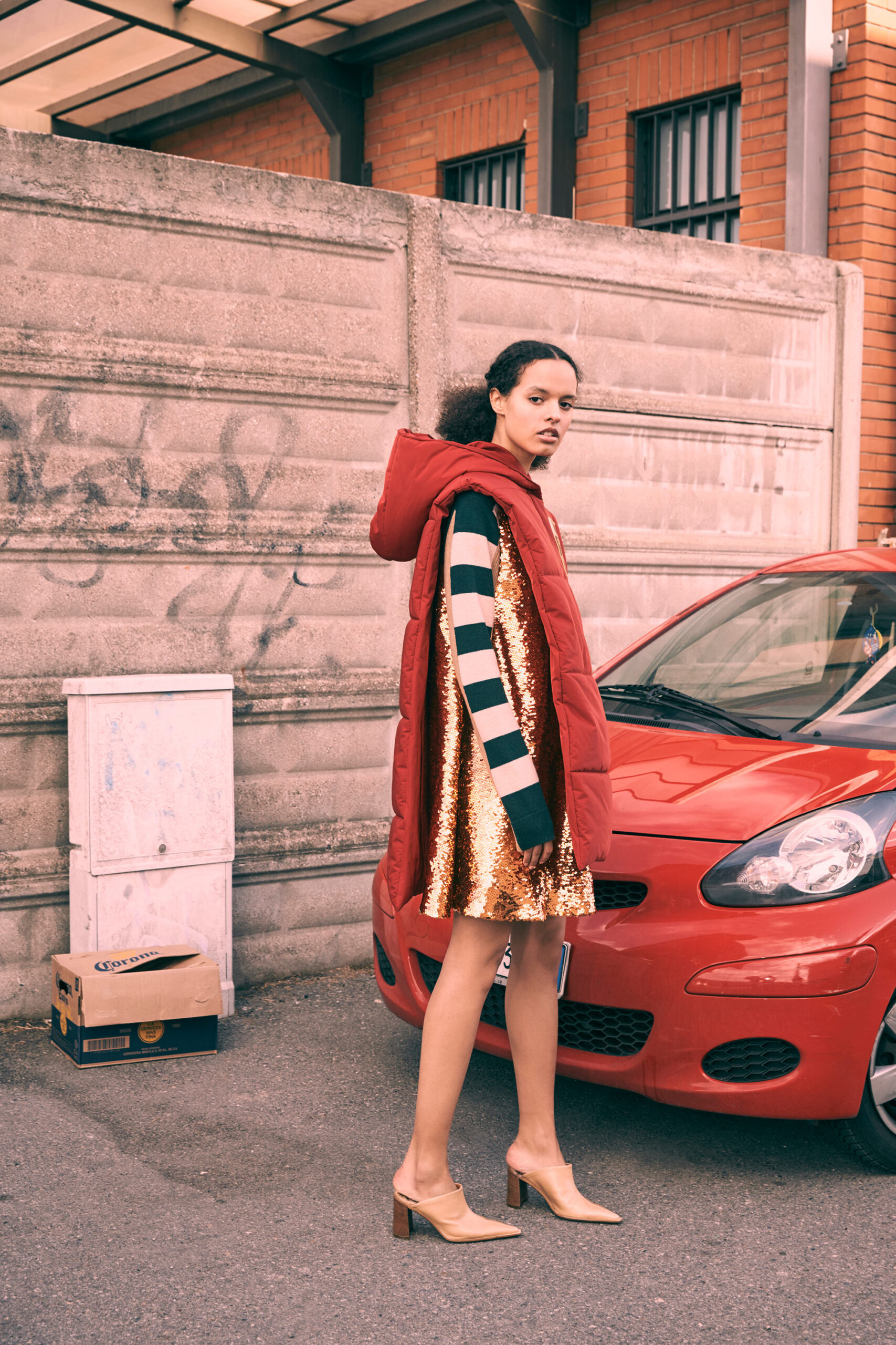red coat and gold sequin dress