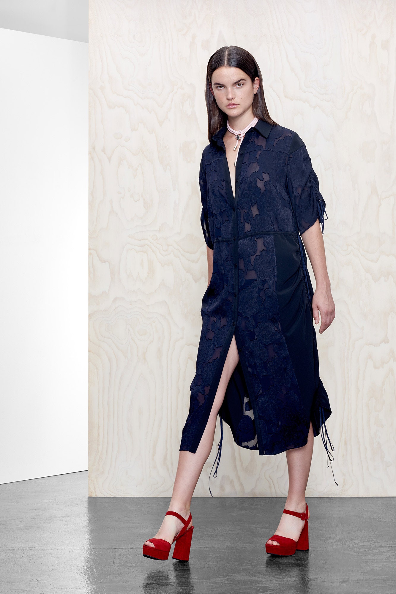 navy embroidered shirt-dress with red shoes