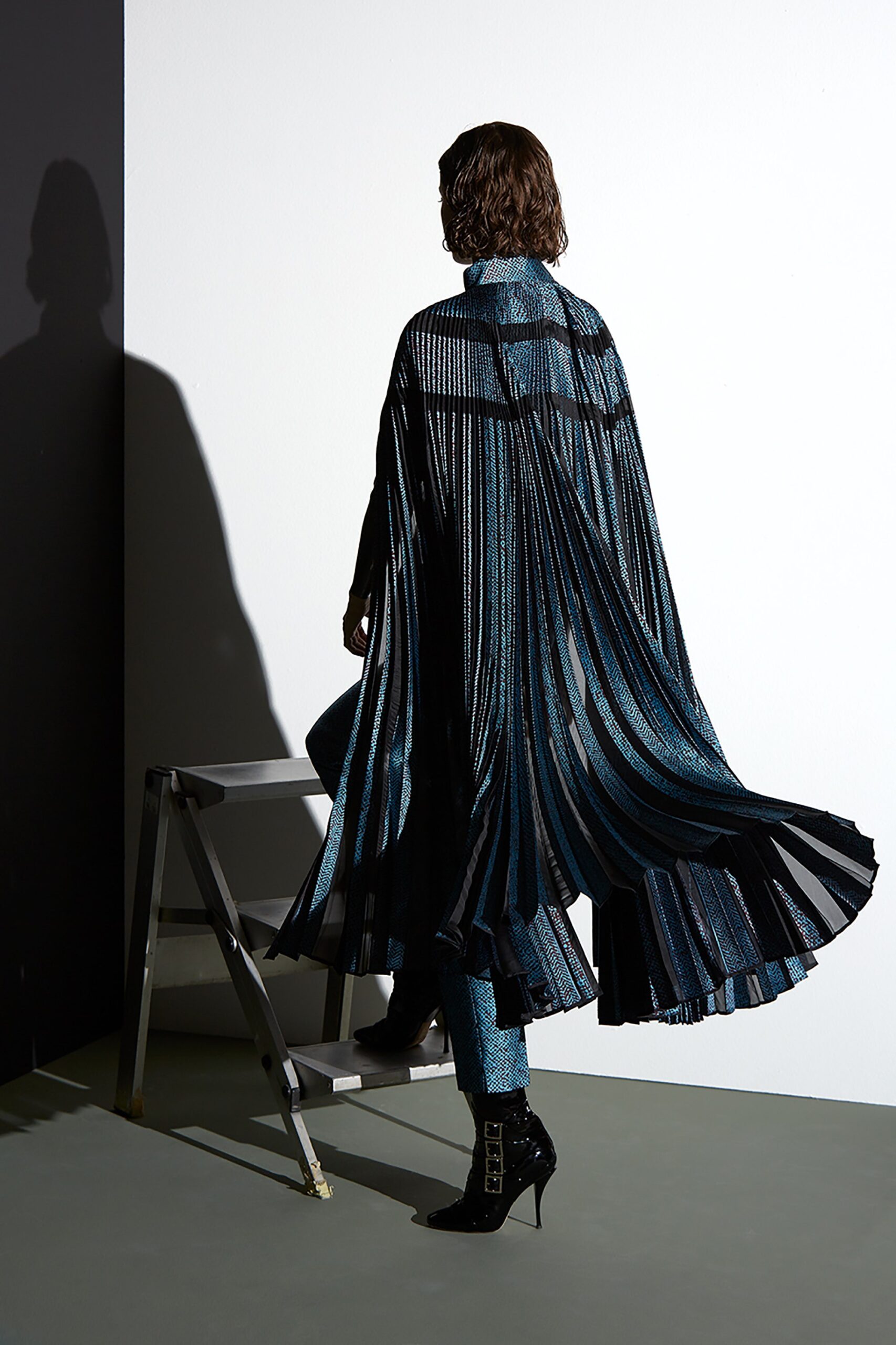 black silk long-sleeve high-neck relaxed pleated flowing cape