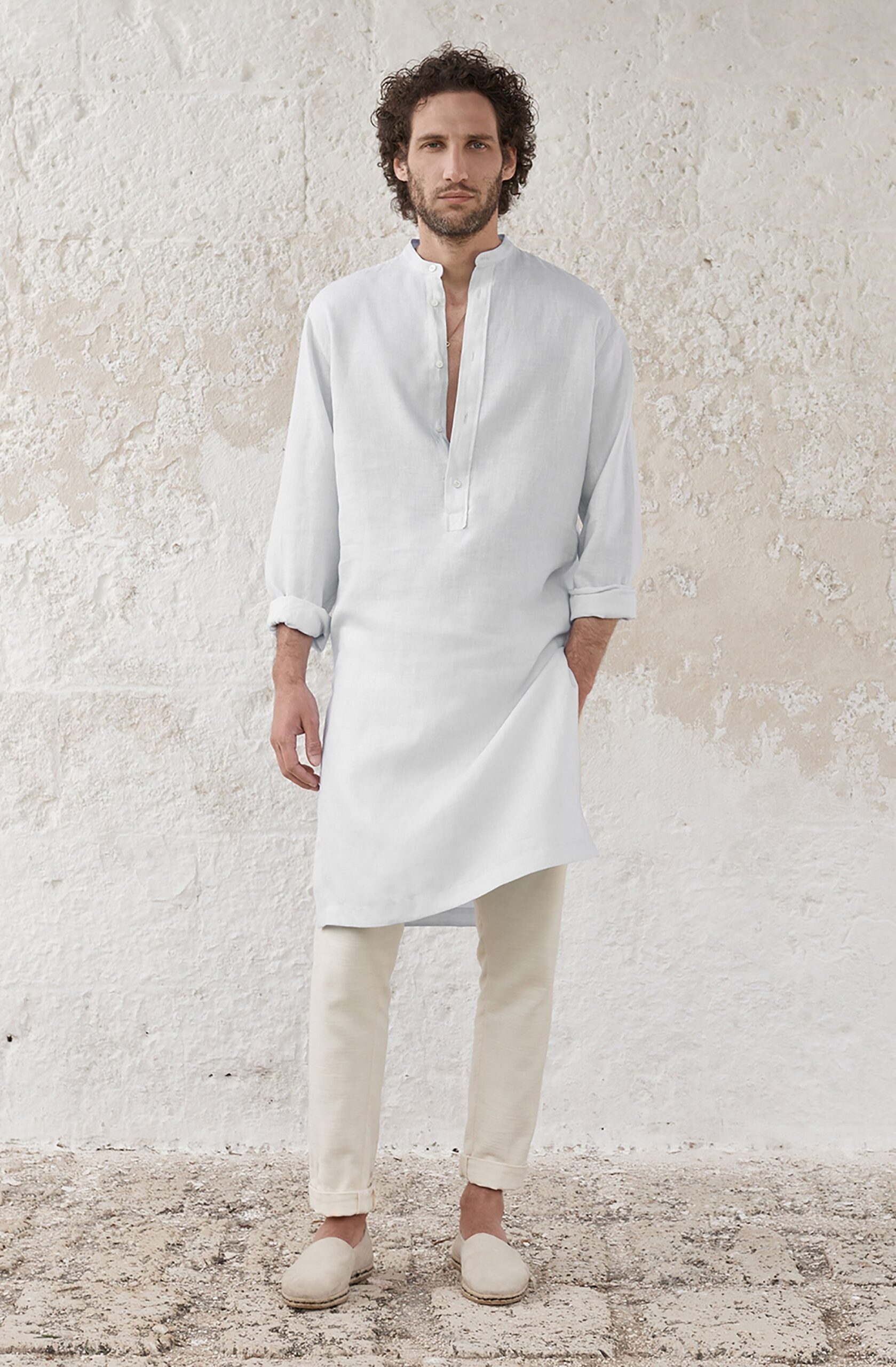 white relaxed shirt with beige pants