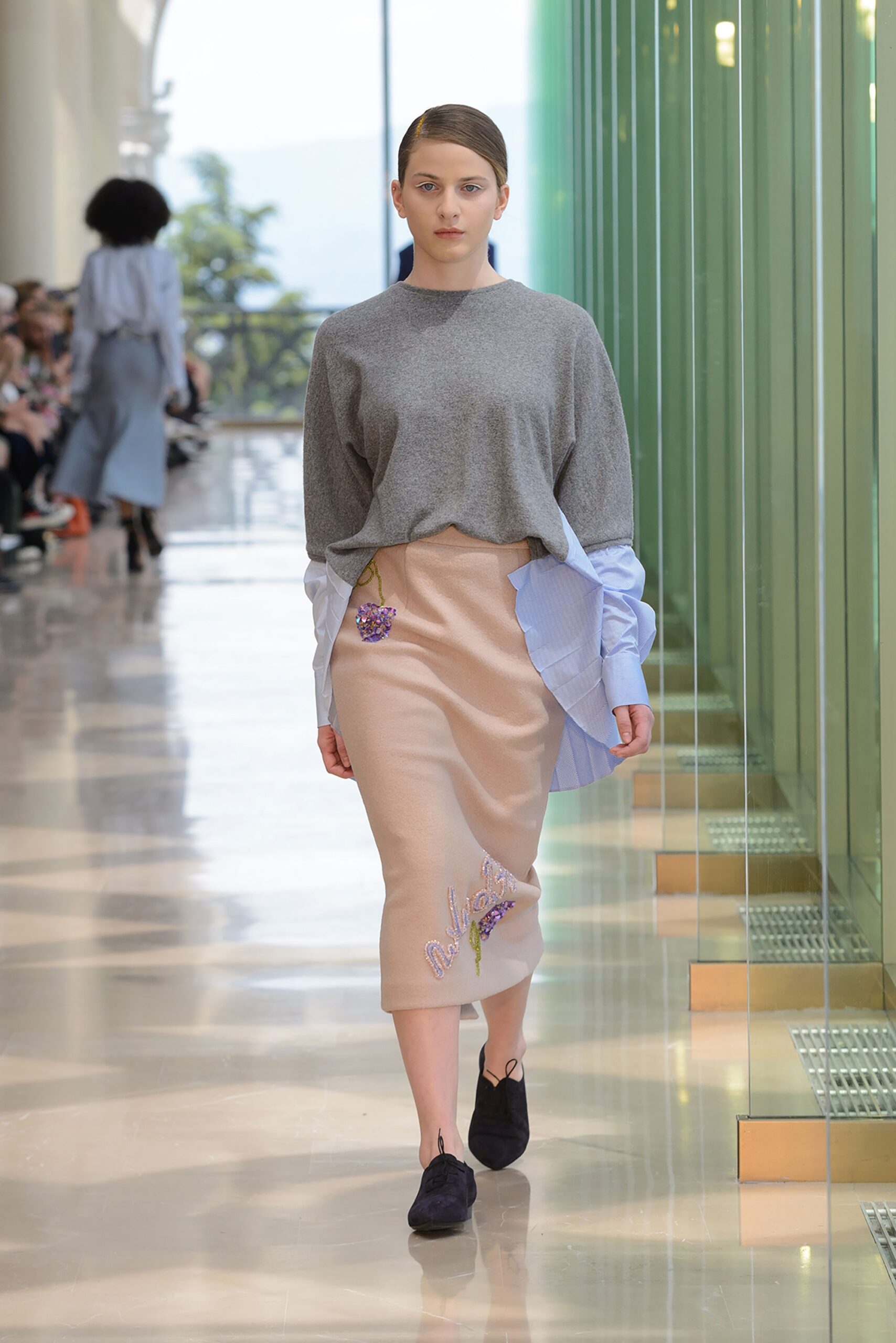 gray relaxed top with beige pencil skirt