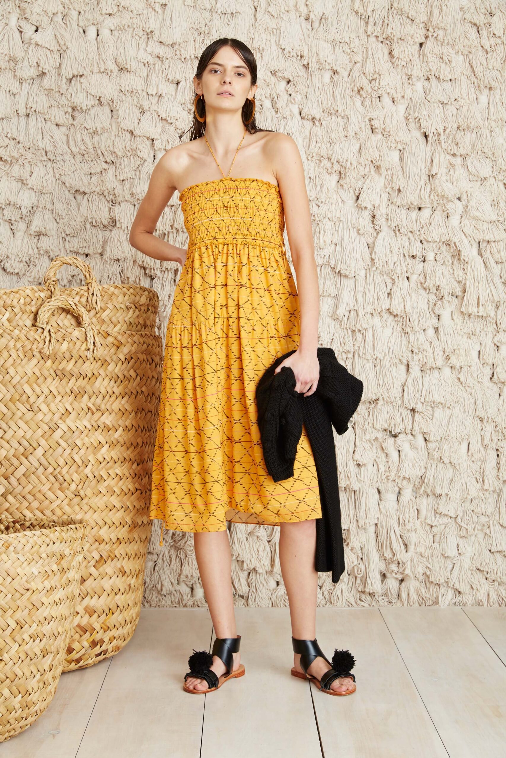 yellow pleated midi dress with black jacket
