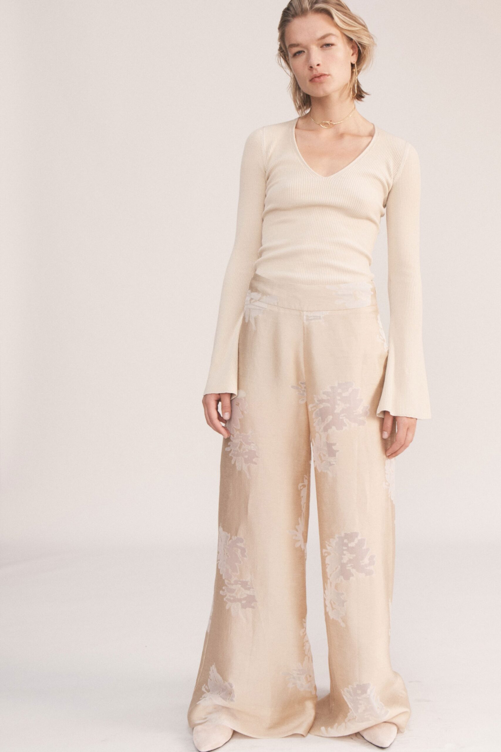 beige ribbed top and floral pants
