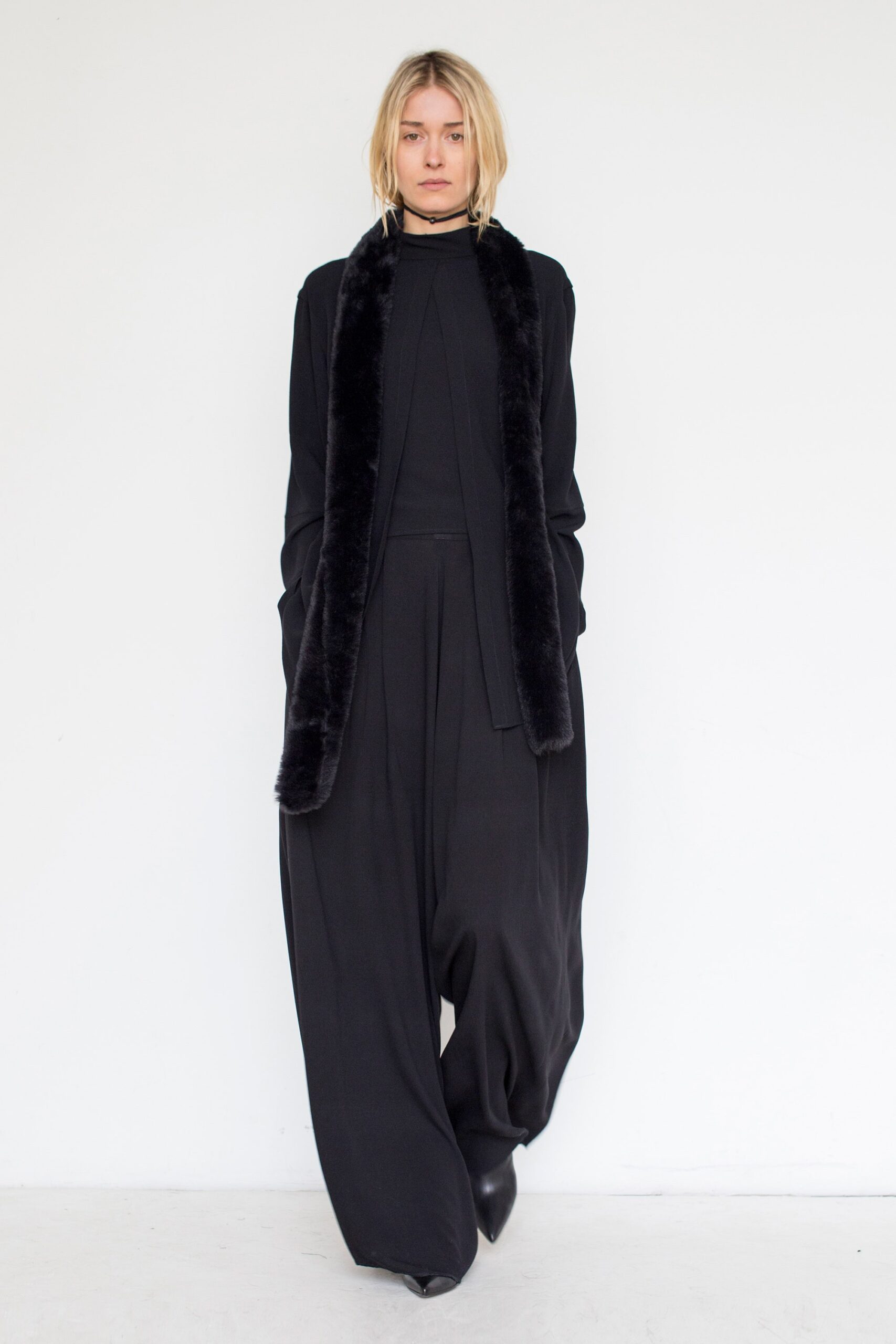 black faux-fur jacket with wide-leg pants