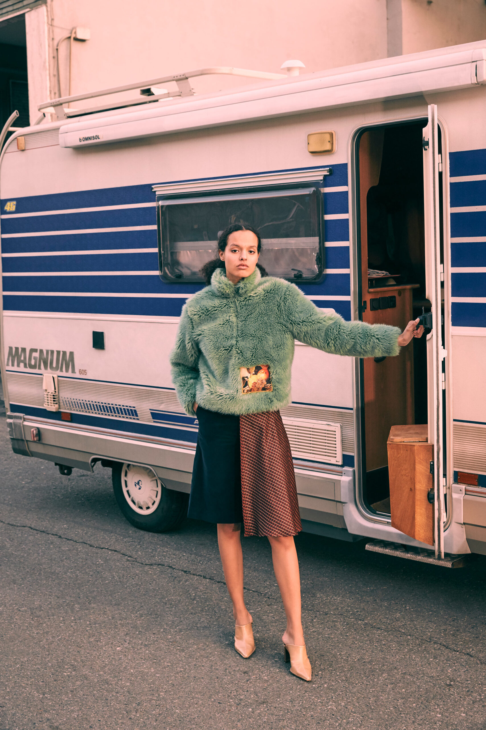 green faux-fur jacket with skirts