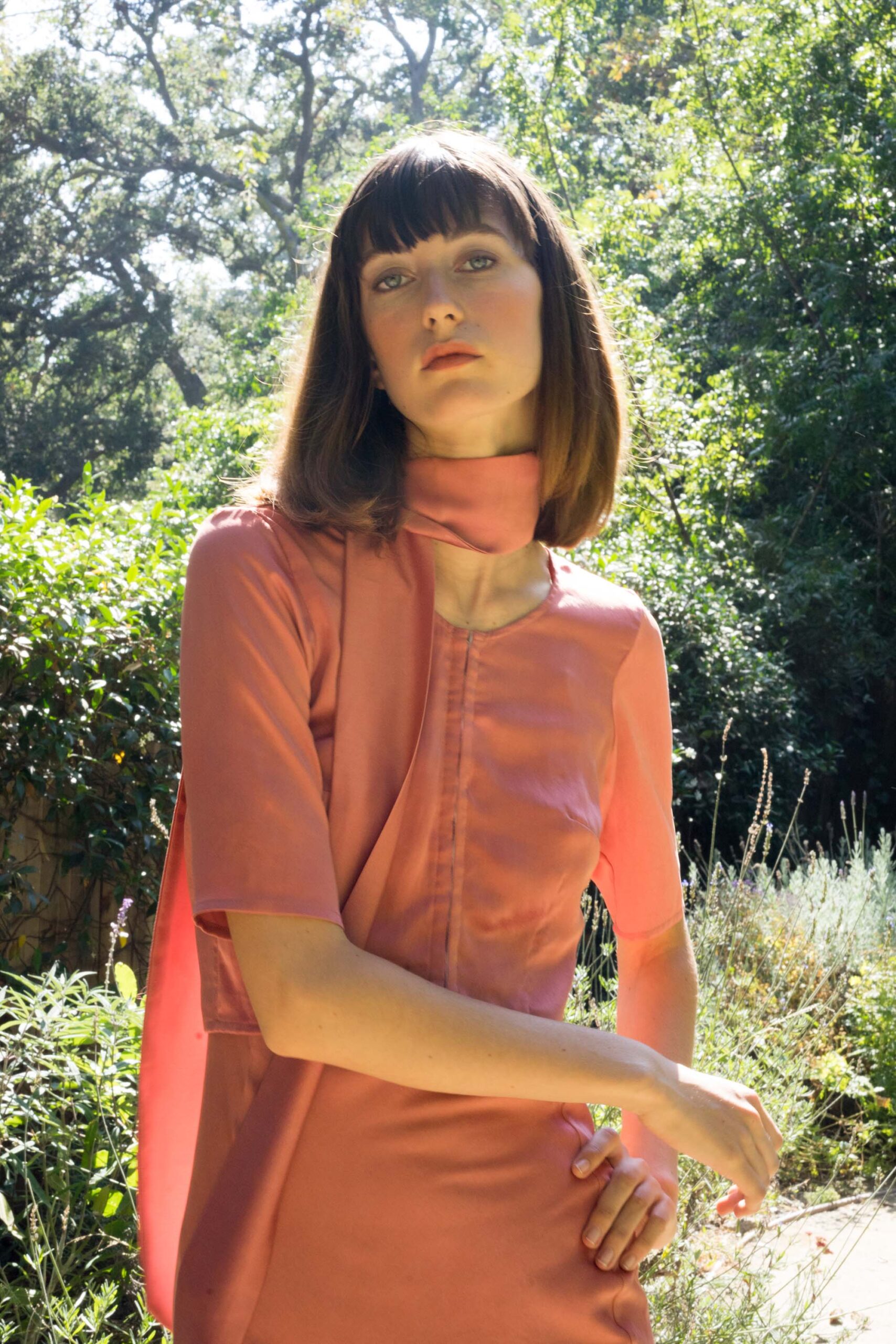 pink silk fitted dress with cape