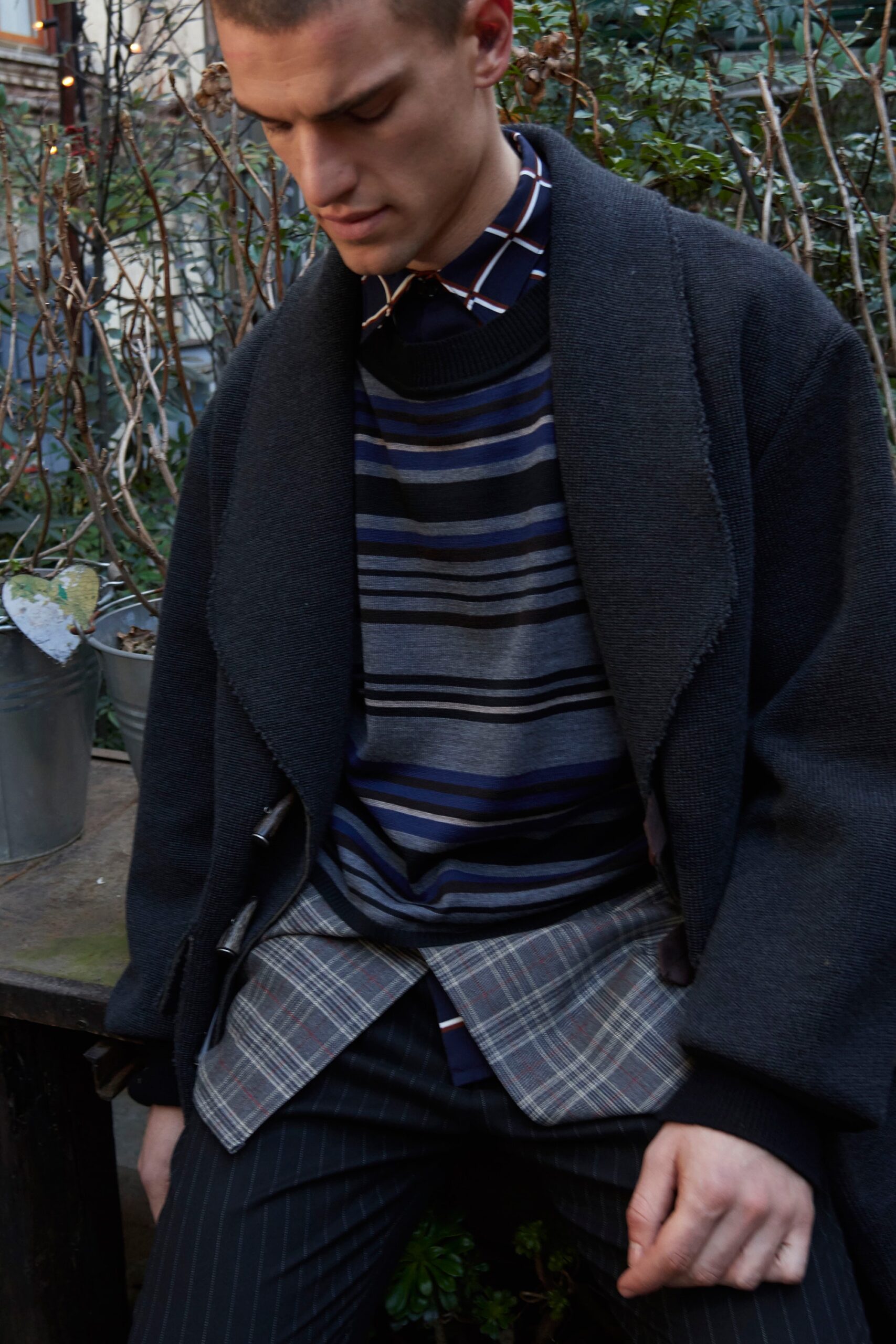 black wool coat with striped sweater