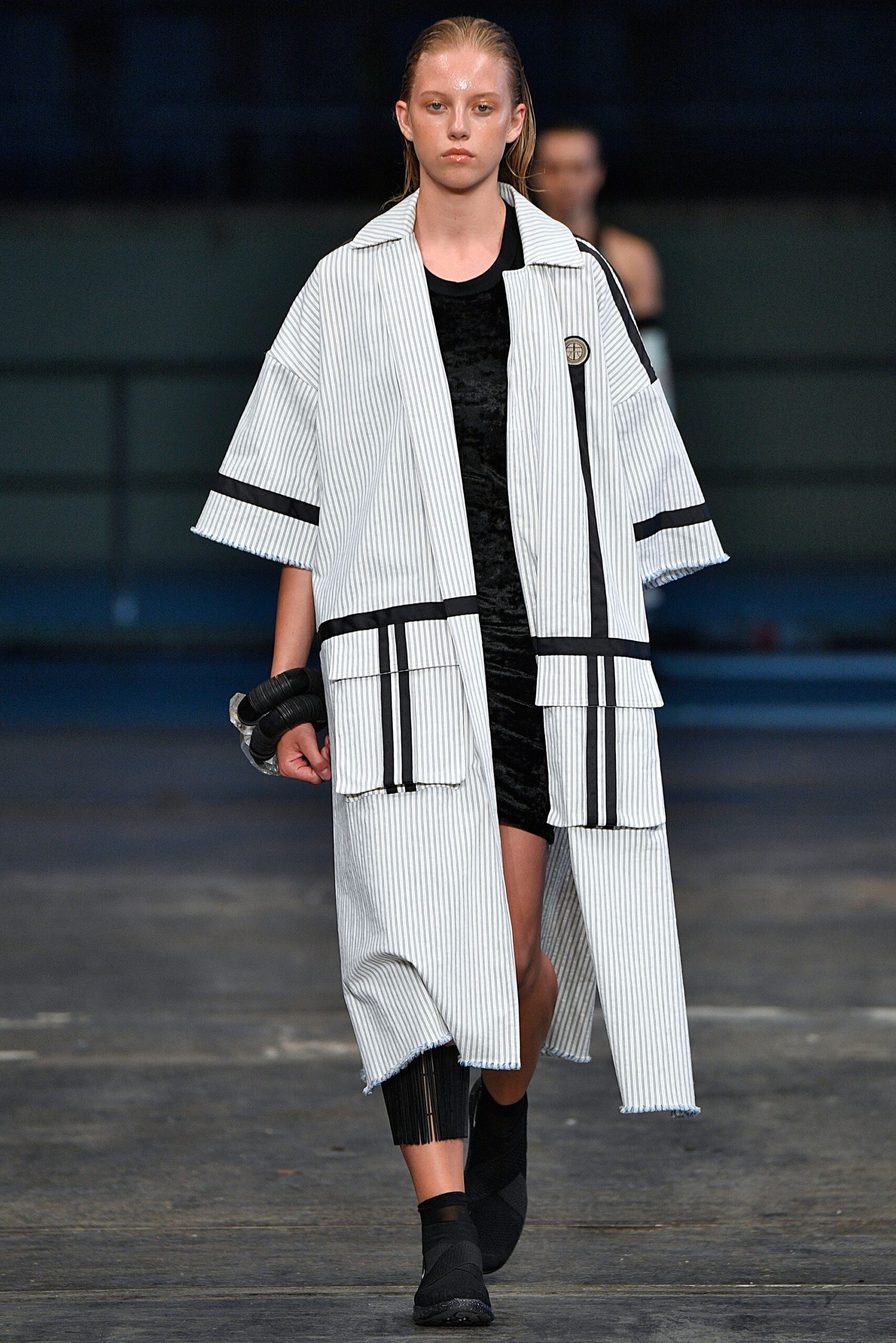 striped coat over black dress