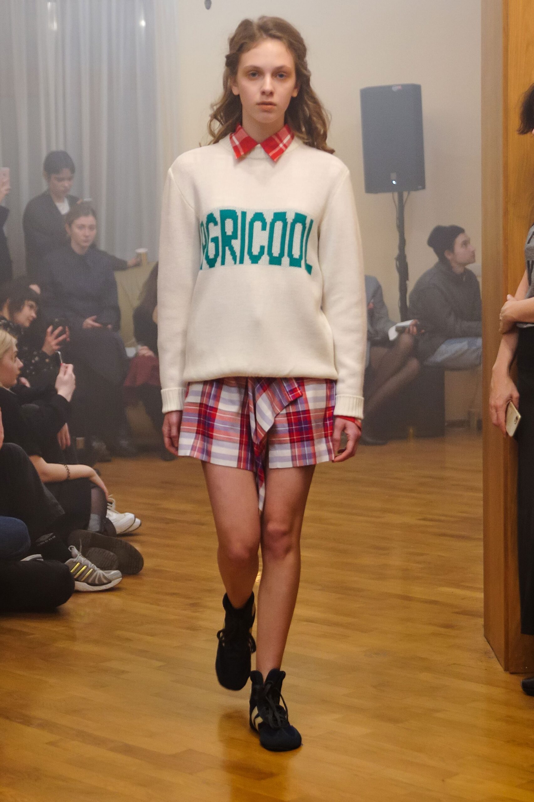 white embroidered sweater with checked shirt and shorts