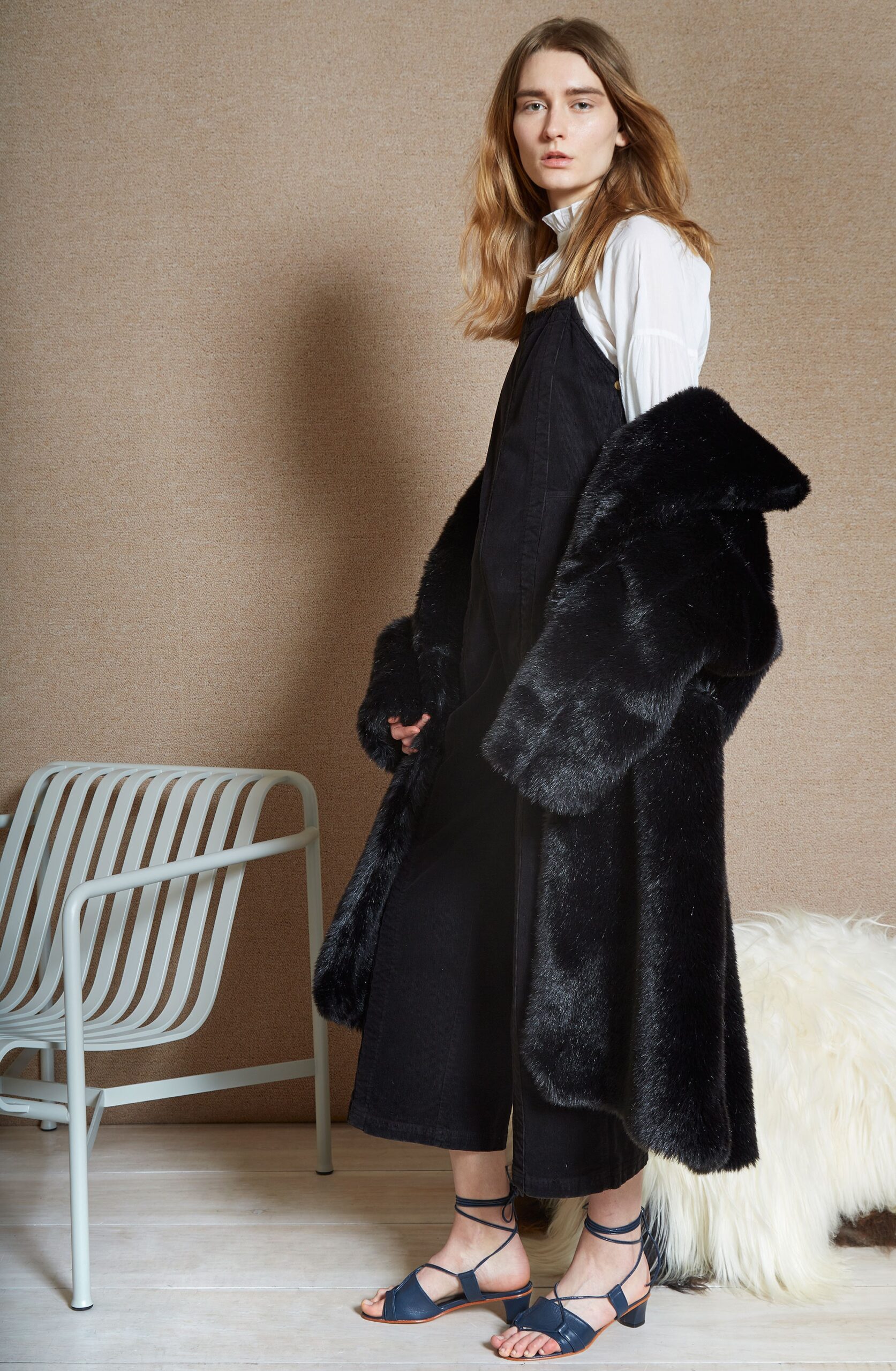 black faux-fur coat with jumpsuit