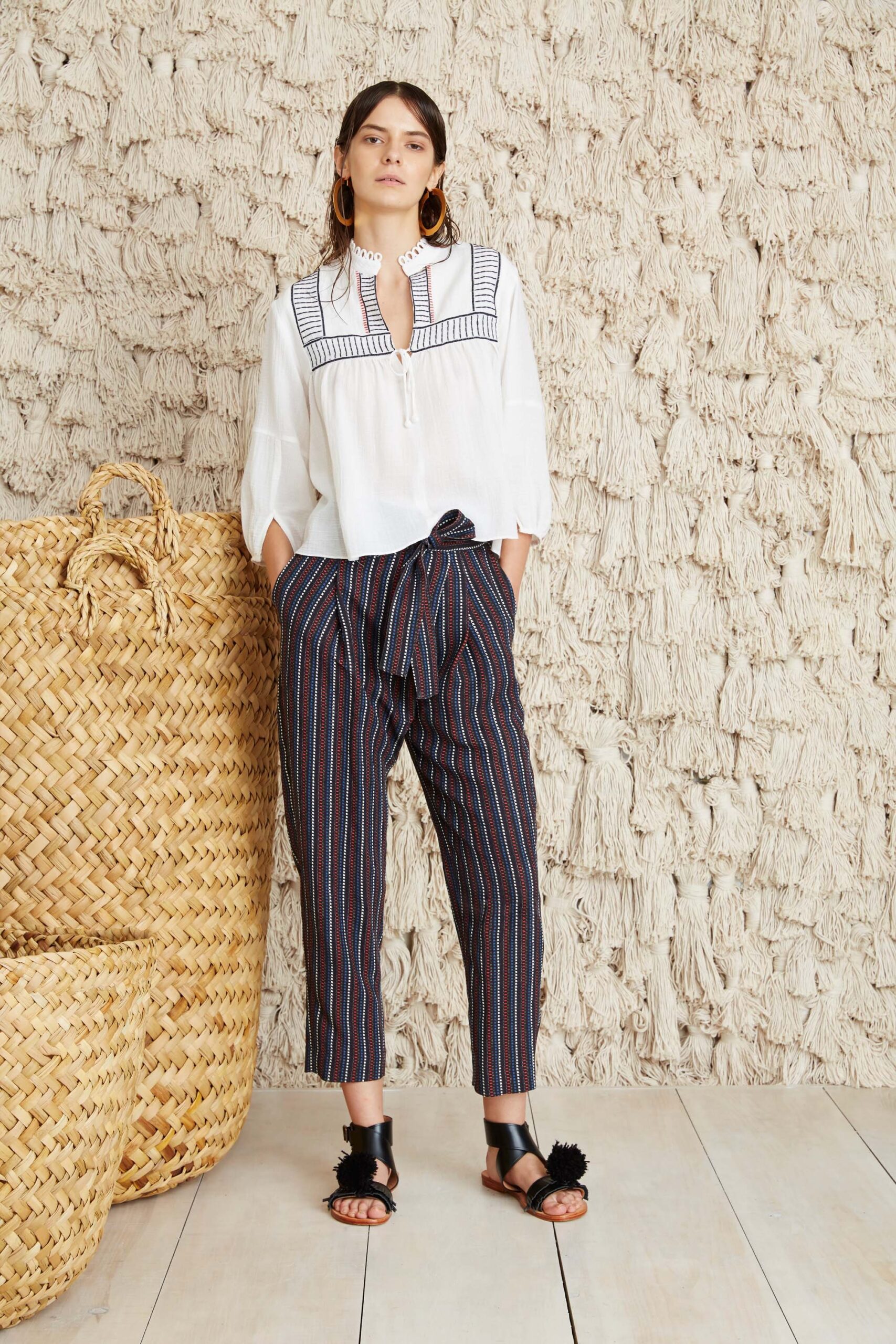 white embroidered blouse with striped pants