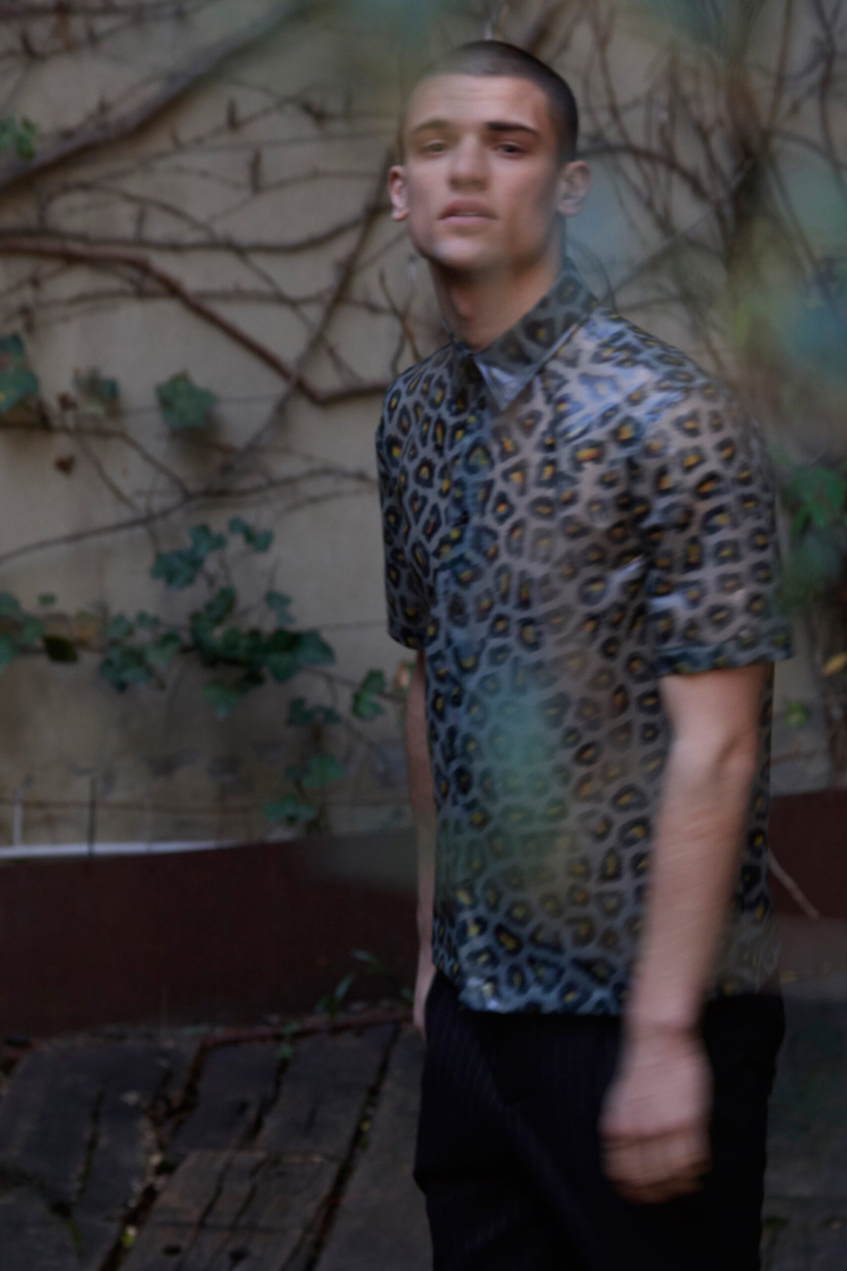 multi-colored animal-print shirt and black pants
