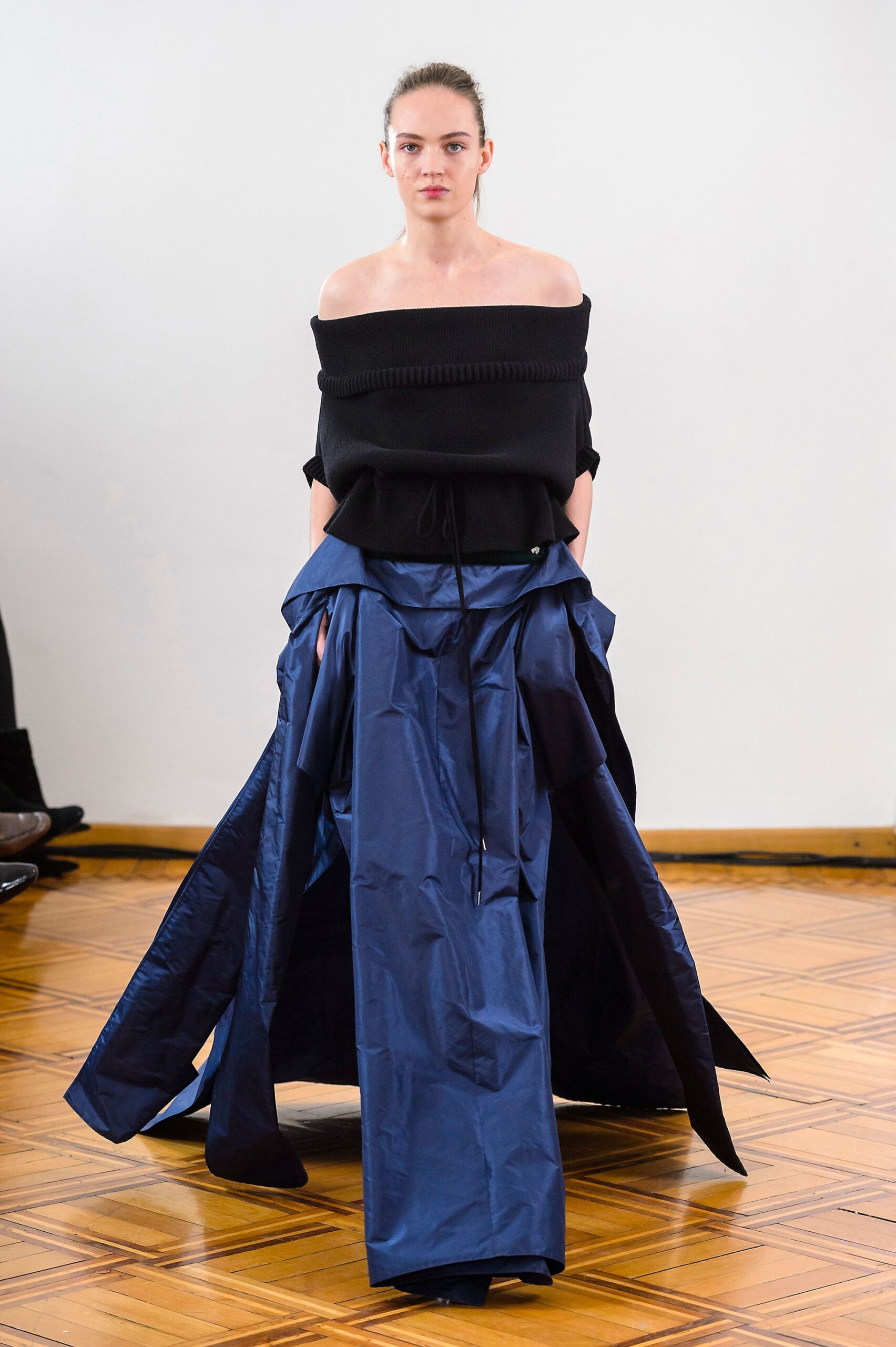 black off-shoulder top with blue layered skirt