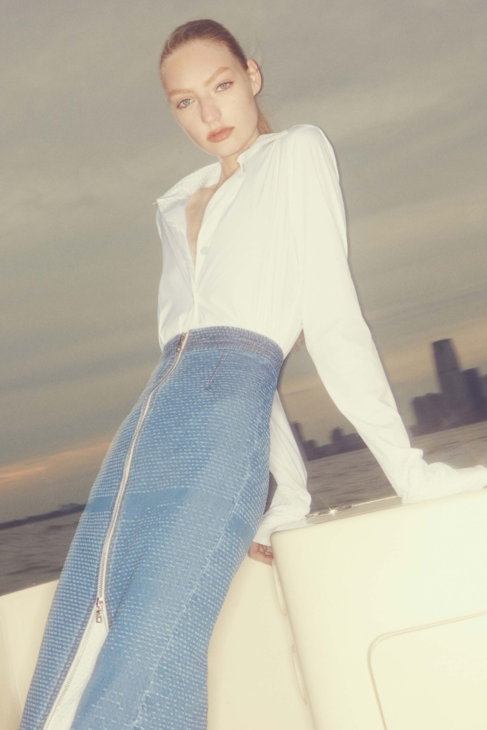 fitted white shirt and blue skirt