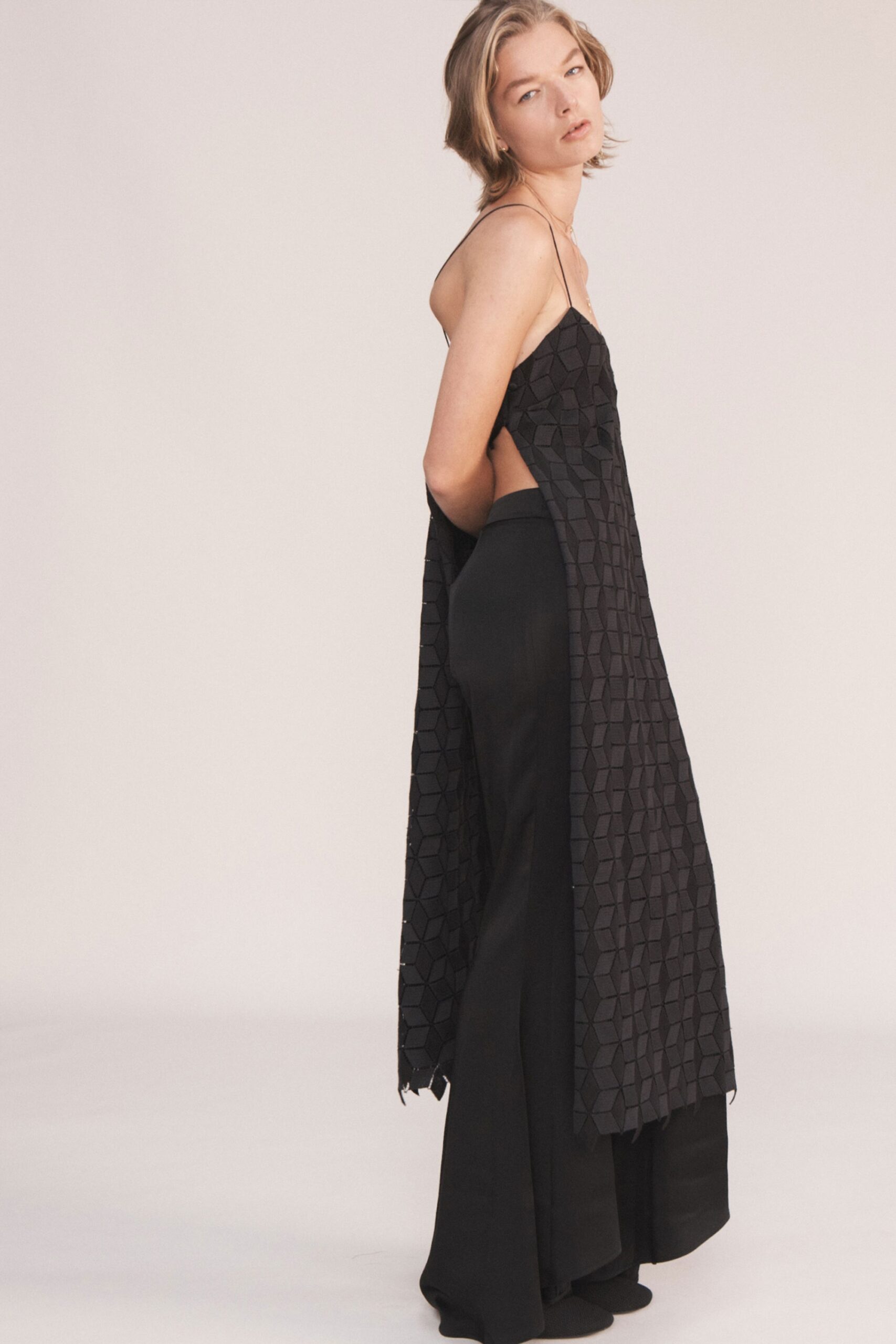 black layered midi dress with wide-leg pants