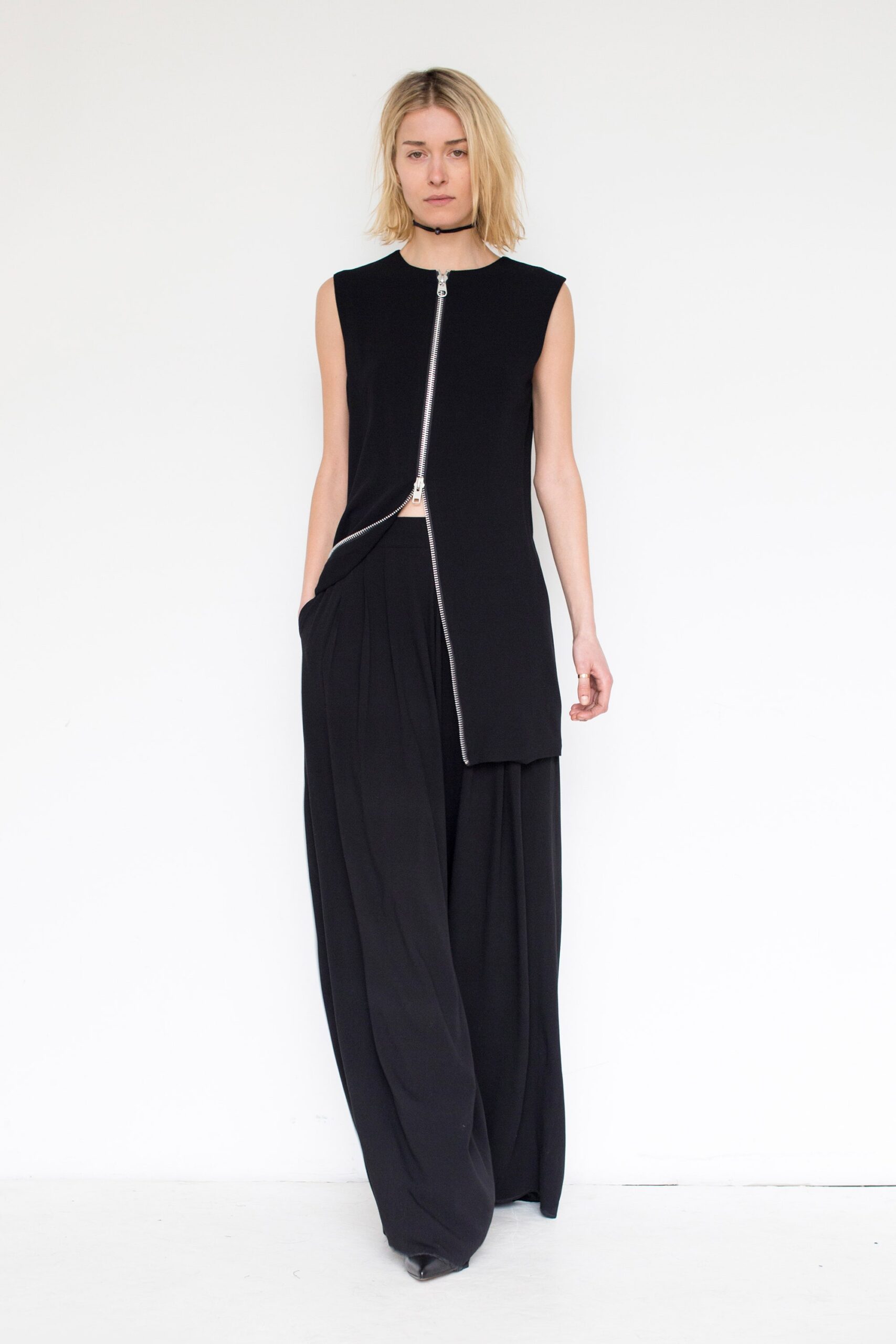 black fitted top and relaxed pants