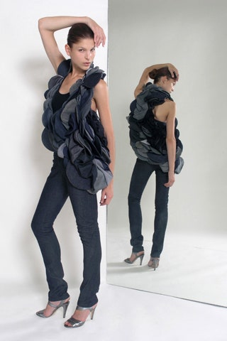 ruffled black top with slim pants