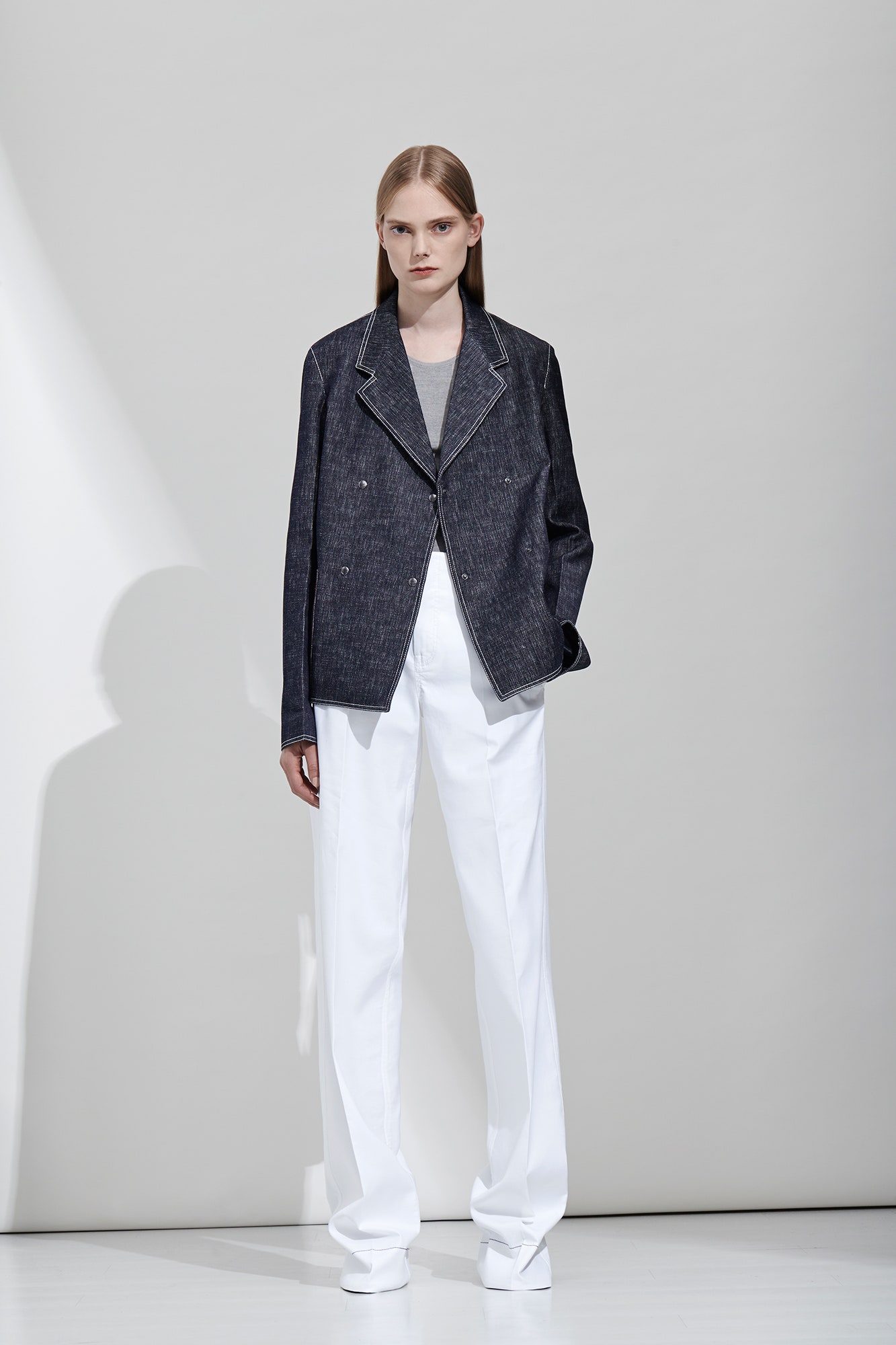 blue denim jacket with white pants
