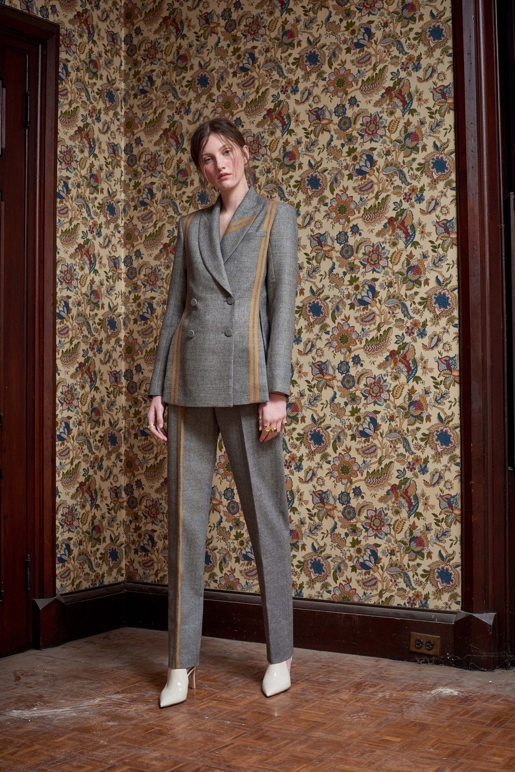 gray tailored suit with white shoes