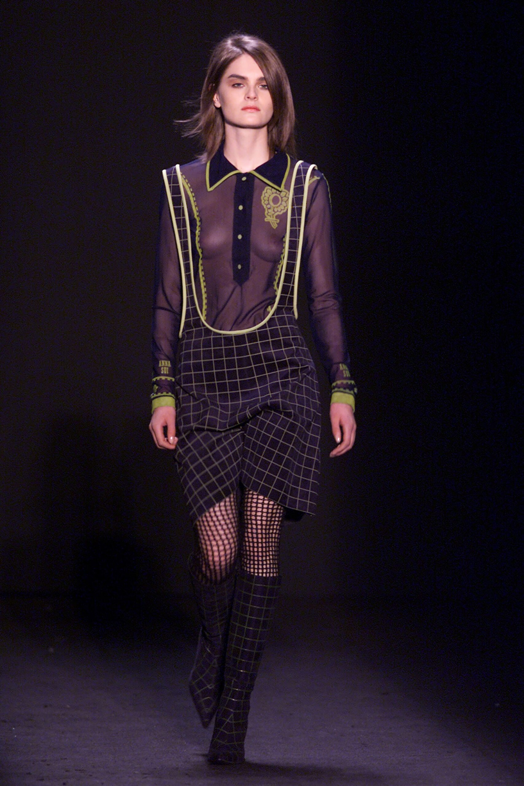 black fitted shirt and mini skirt