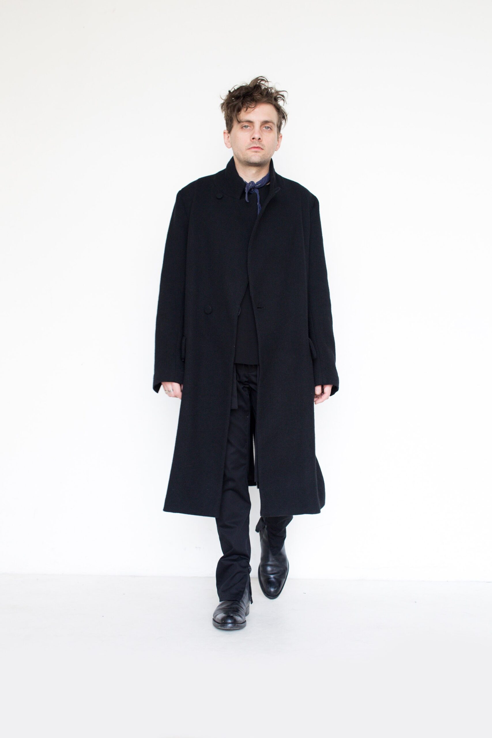 black wool coat and tailored pants