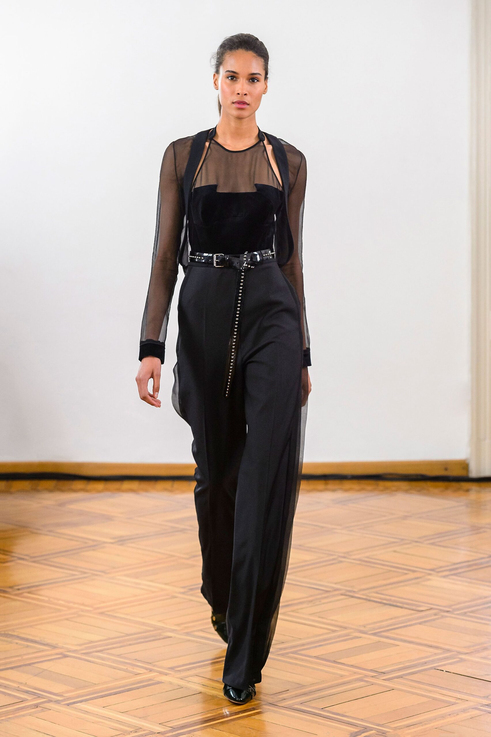 black fitted top and tailored pants