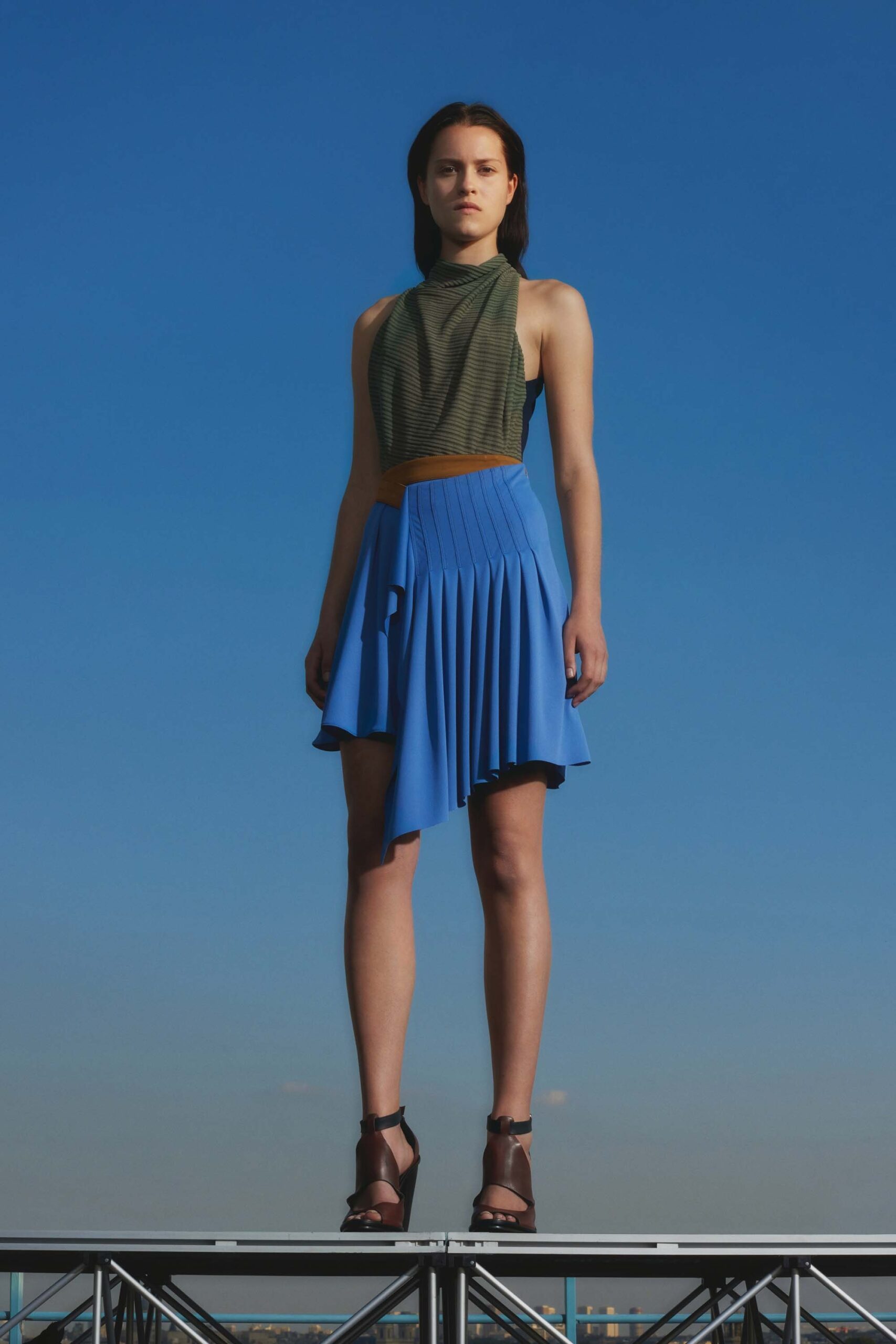green fitted top blue pleated skirt