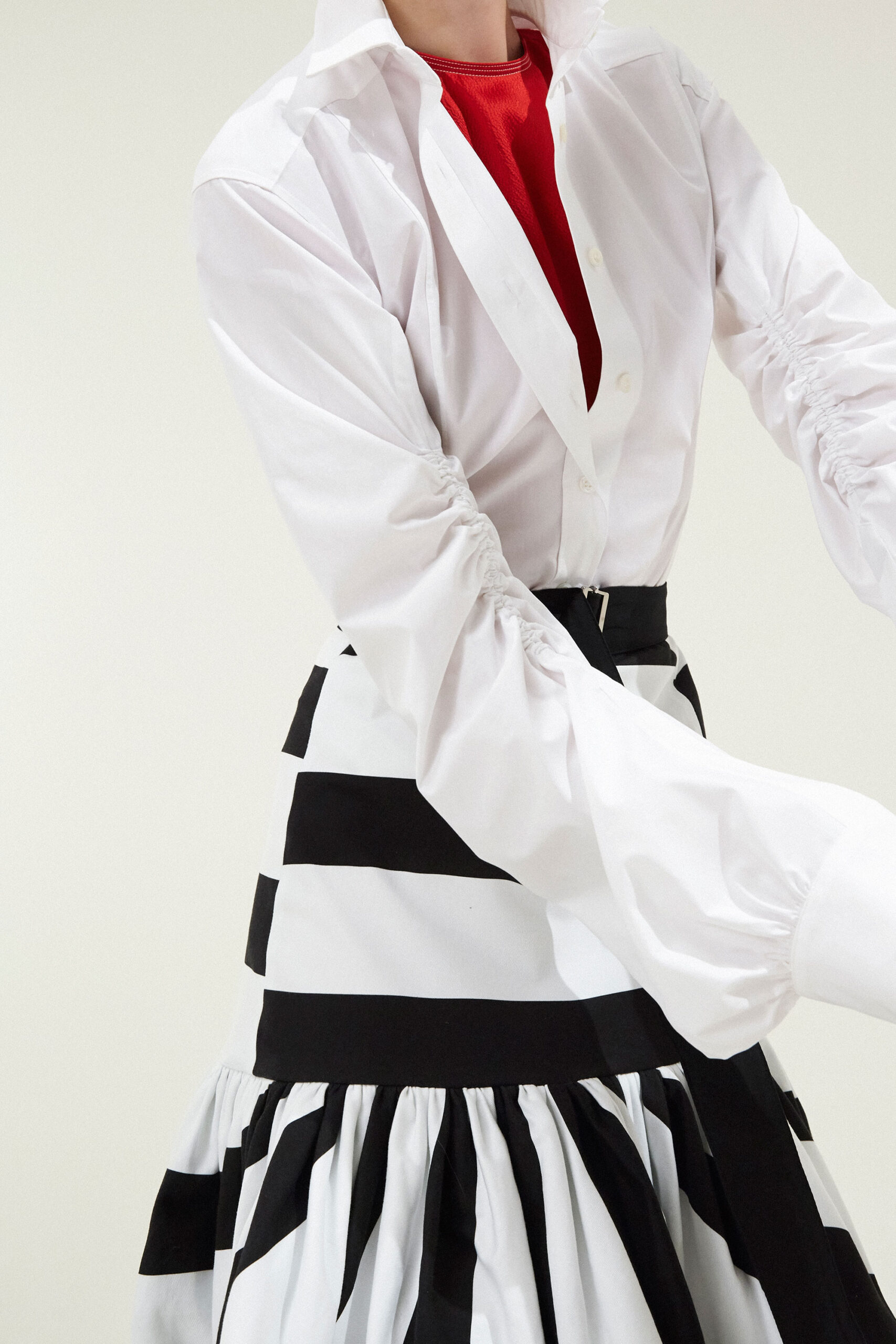 white fitted shirt with black and white skirt