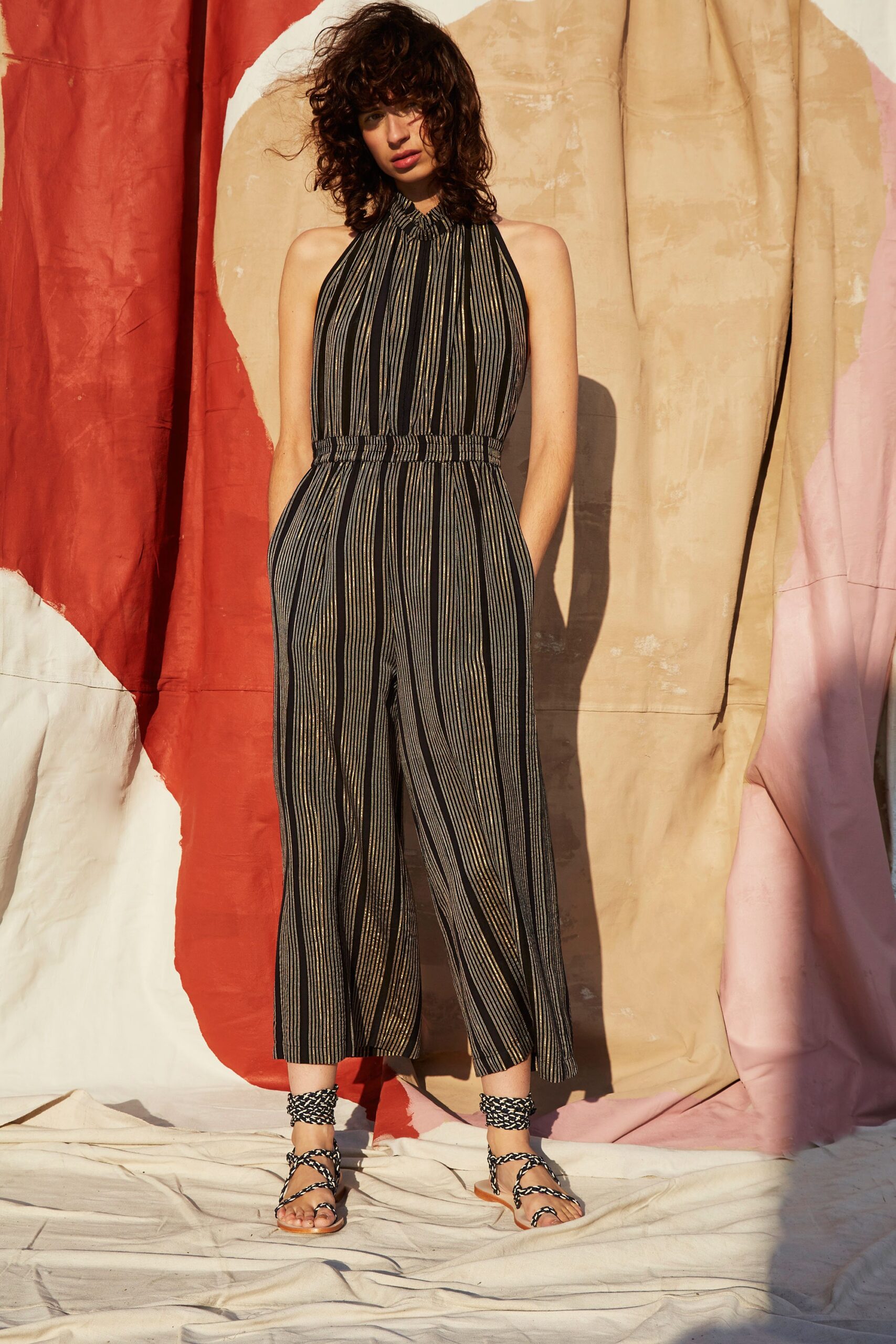 black and gold striped jumpsuit