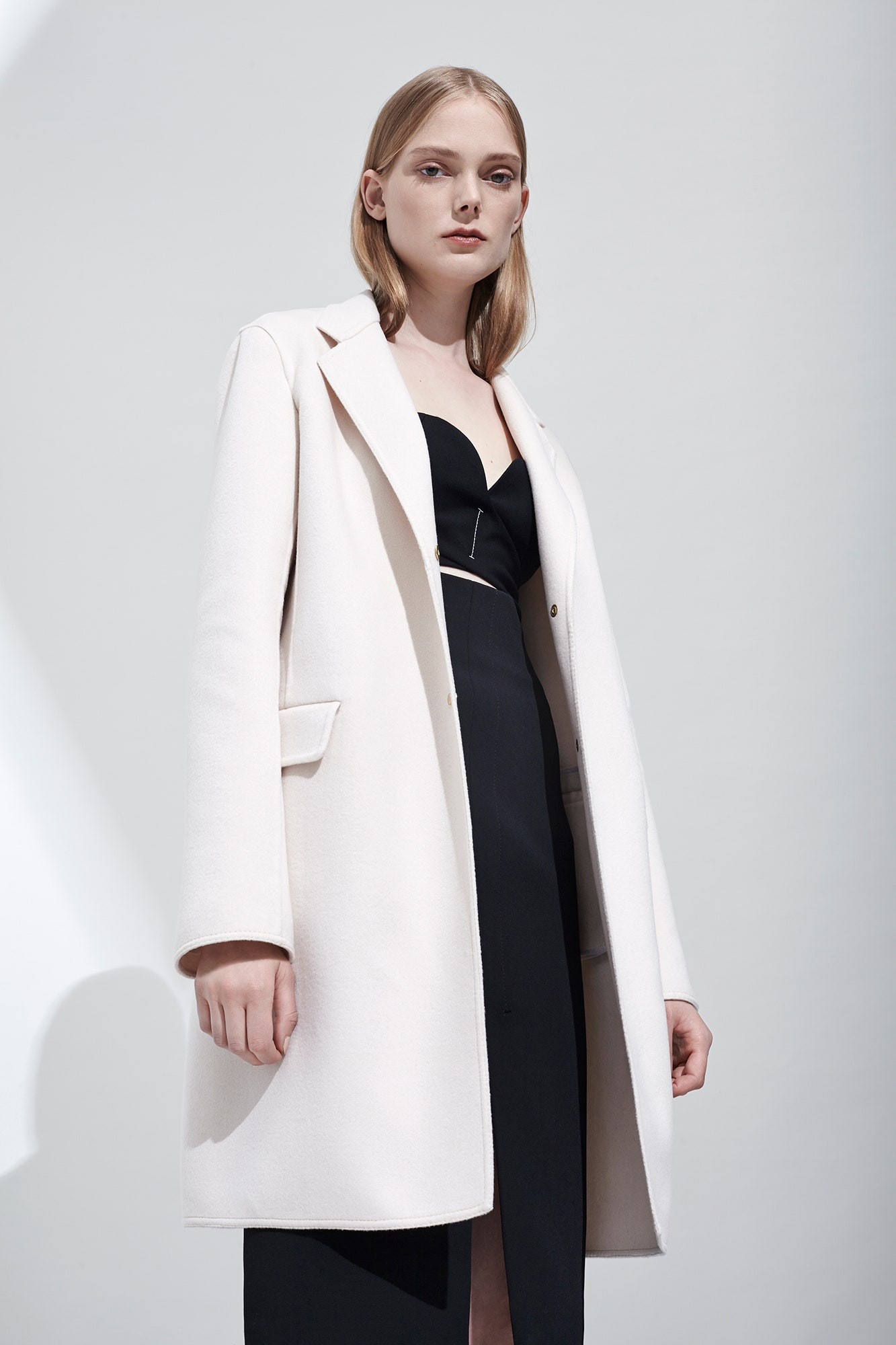 white wool coat and black dress