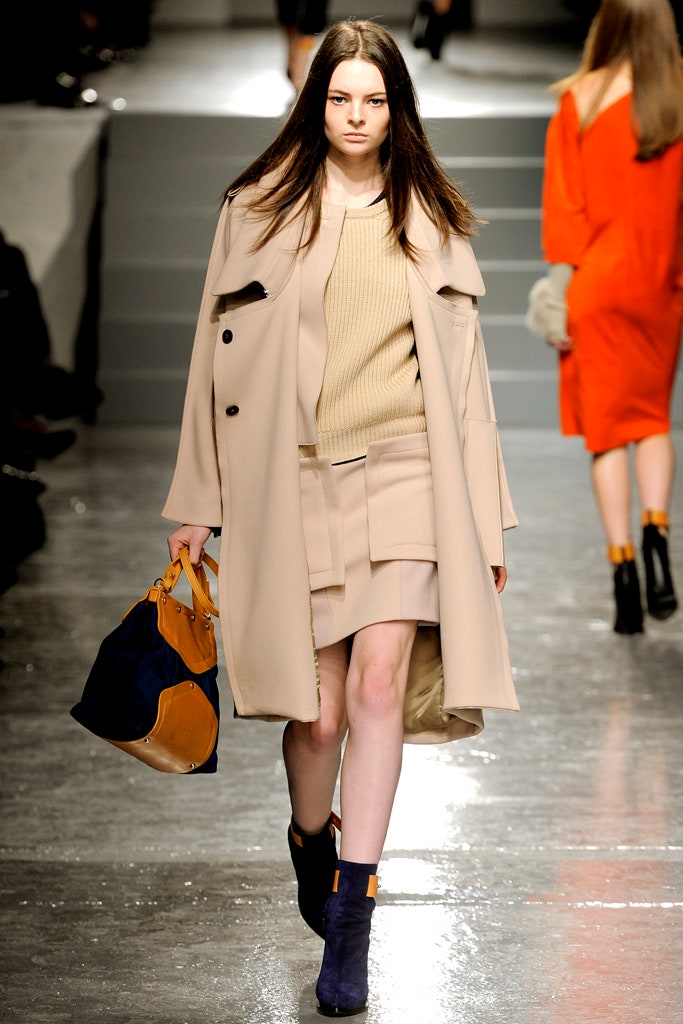 beige coat with tan top and skirt