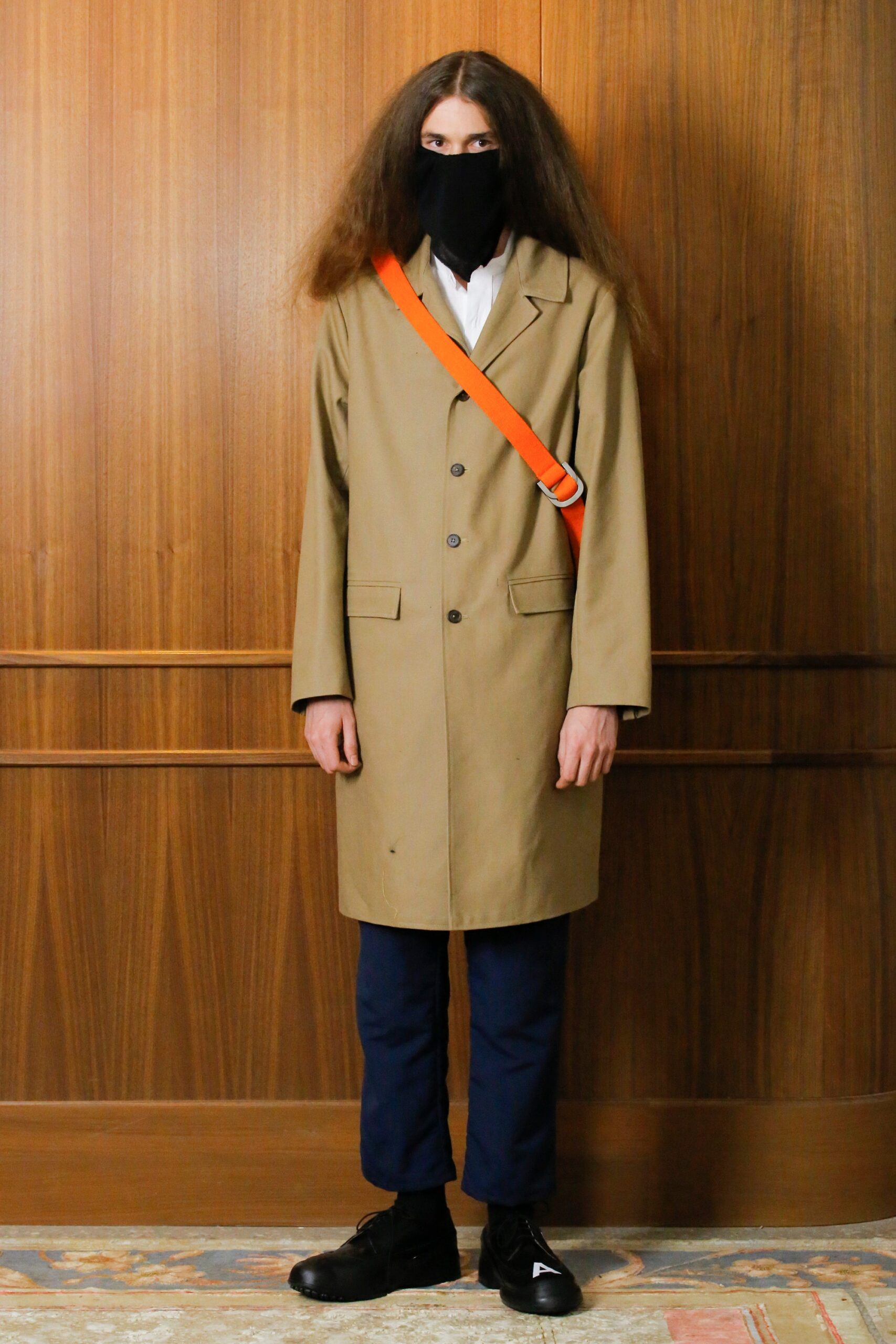 beige coat with blue pants