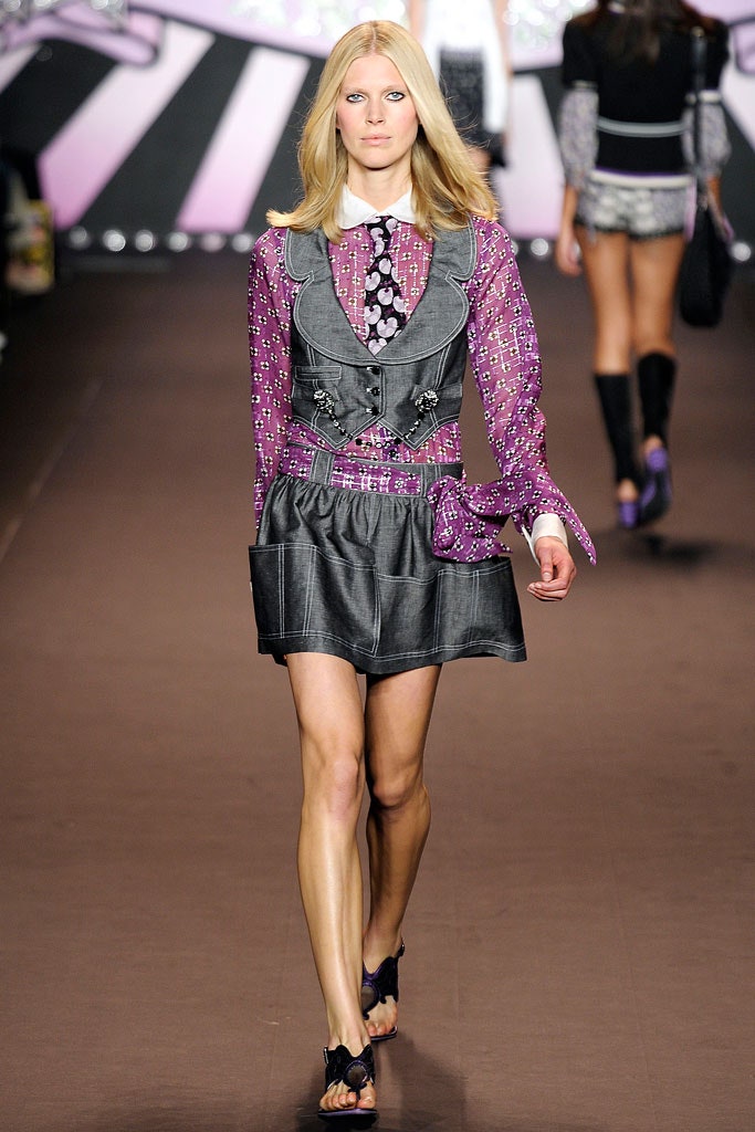 gray leather vest with purple blouse