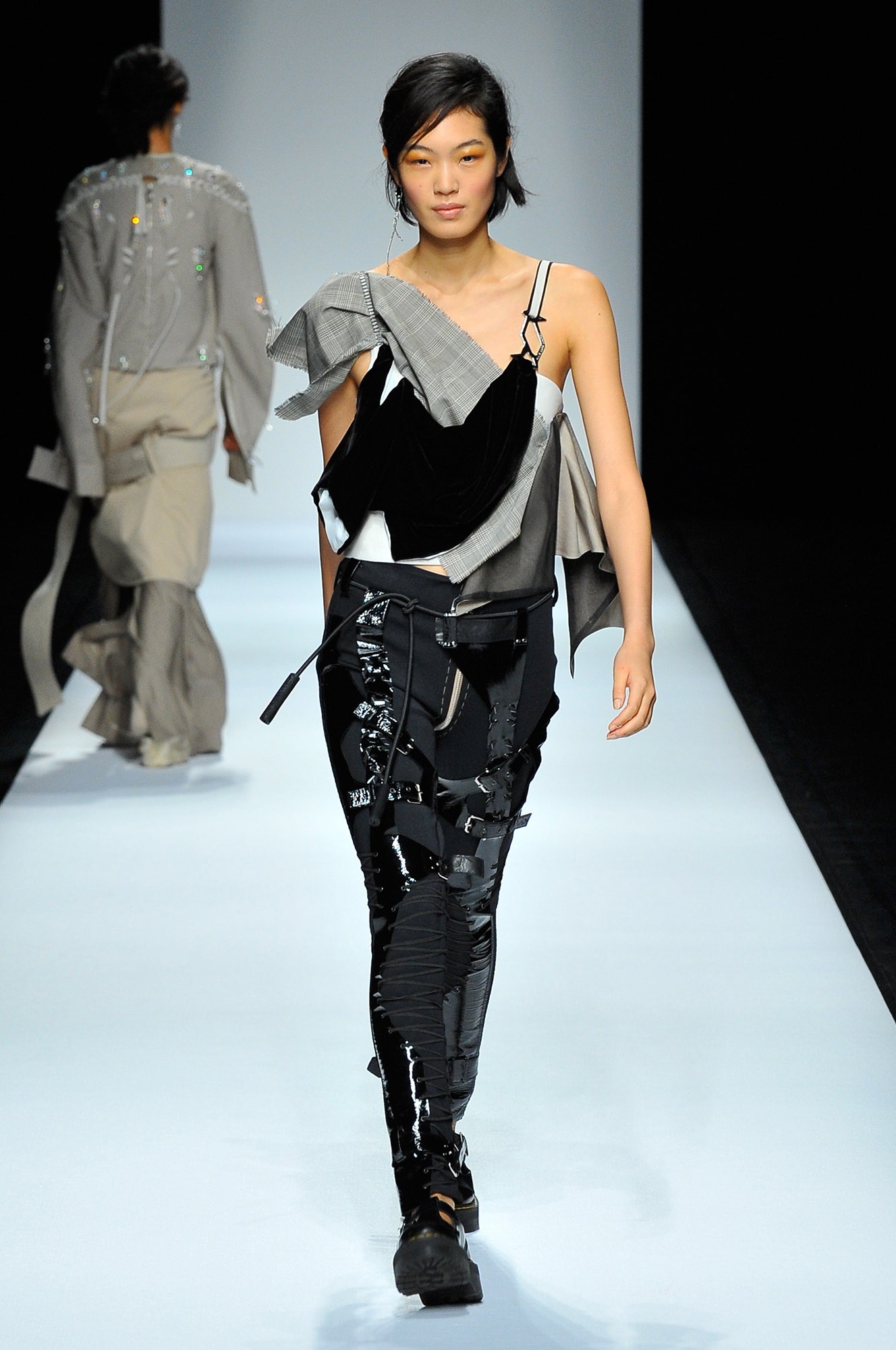 black asymmetric top and slim pants