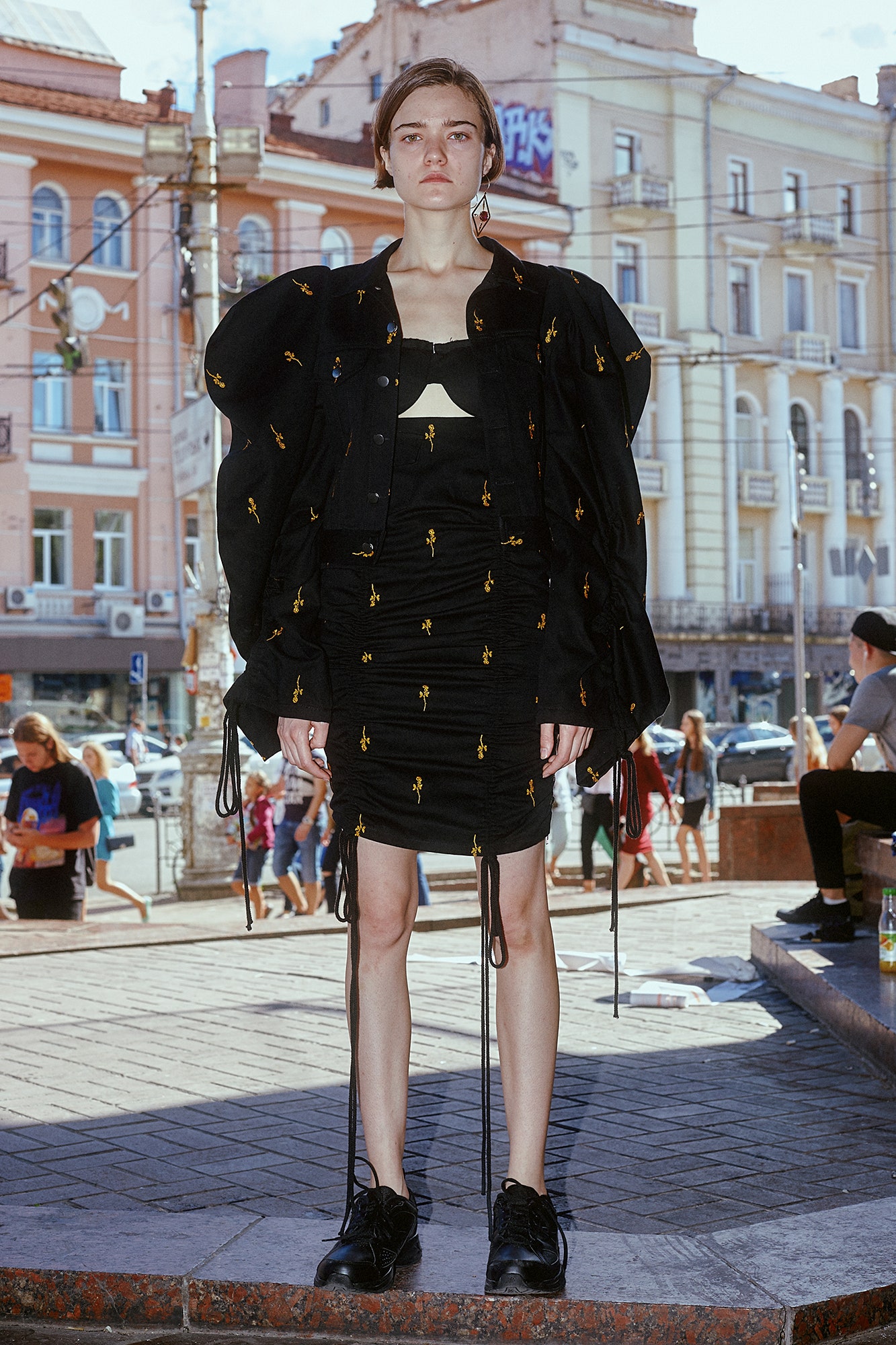 black relaxed jacket and fitted mini dress