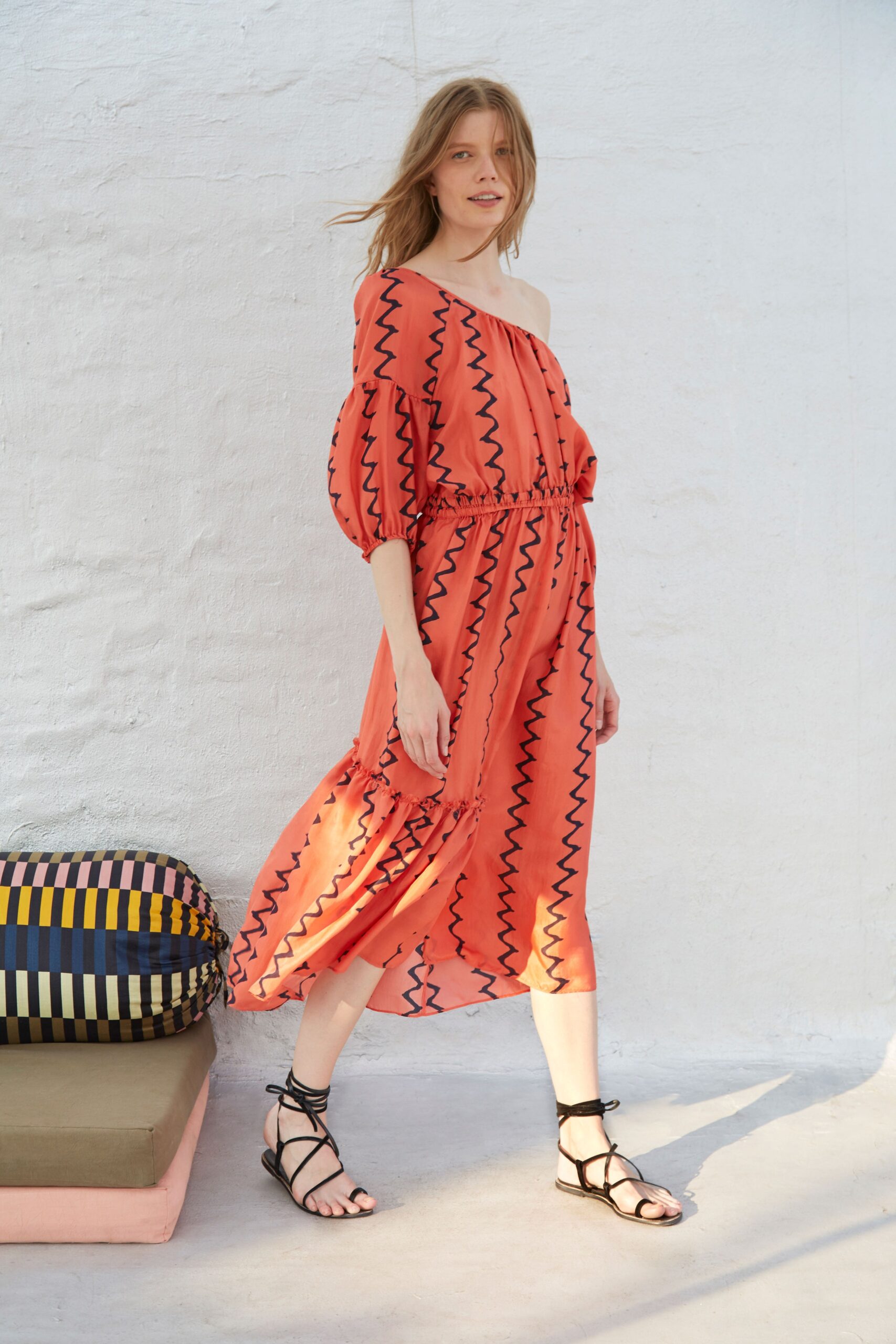 orange pleated off-shoulder dress